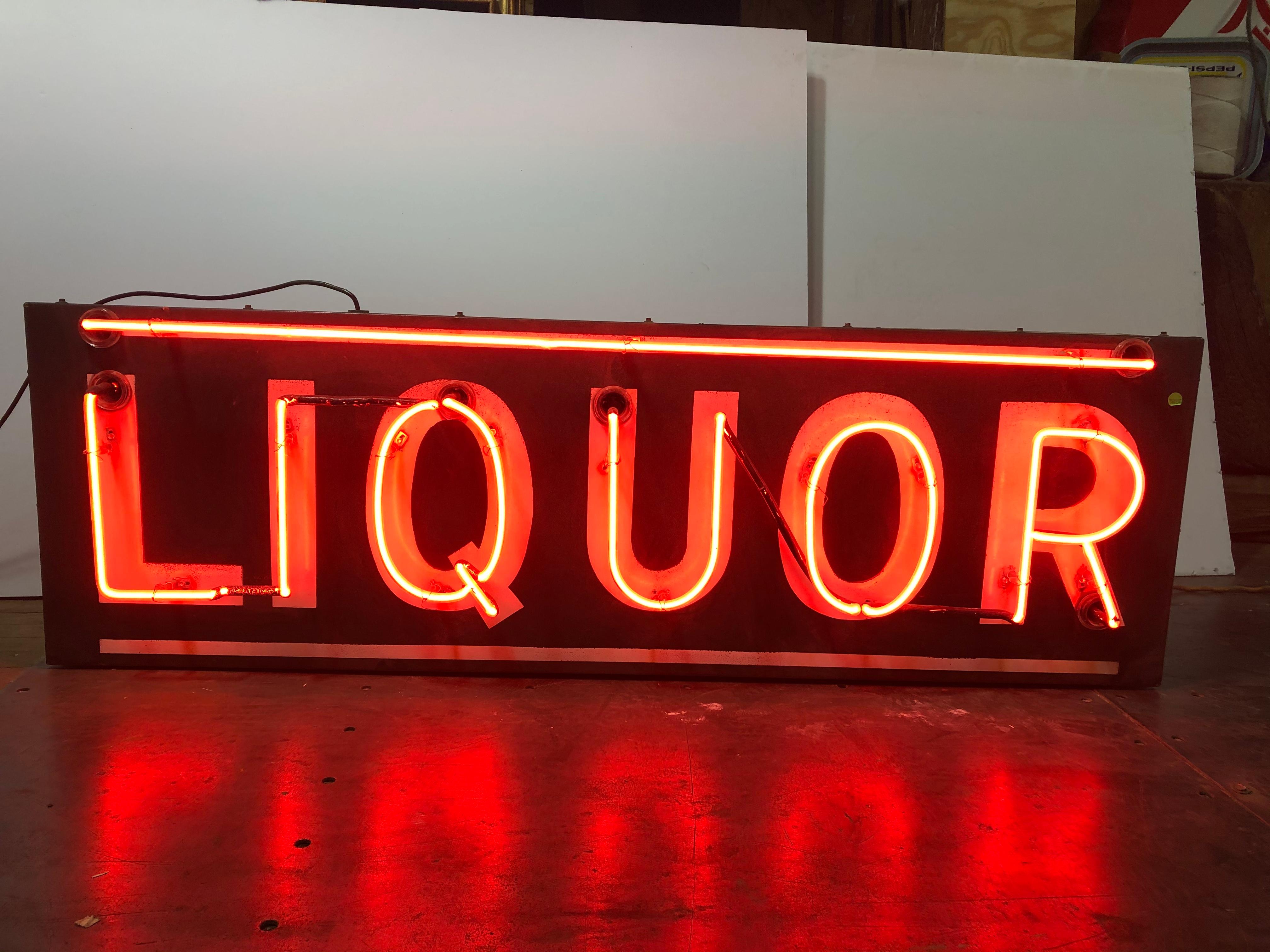 1950’s single sided Liquor neon and porcelain sign. New transformer and new wiring. It does work.