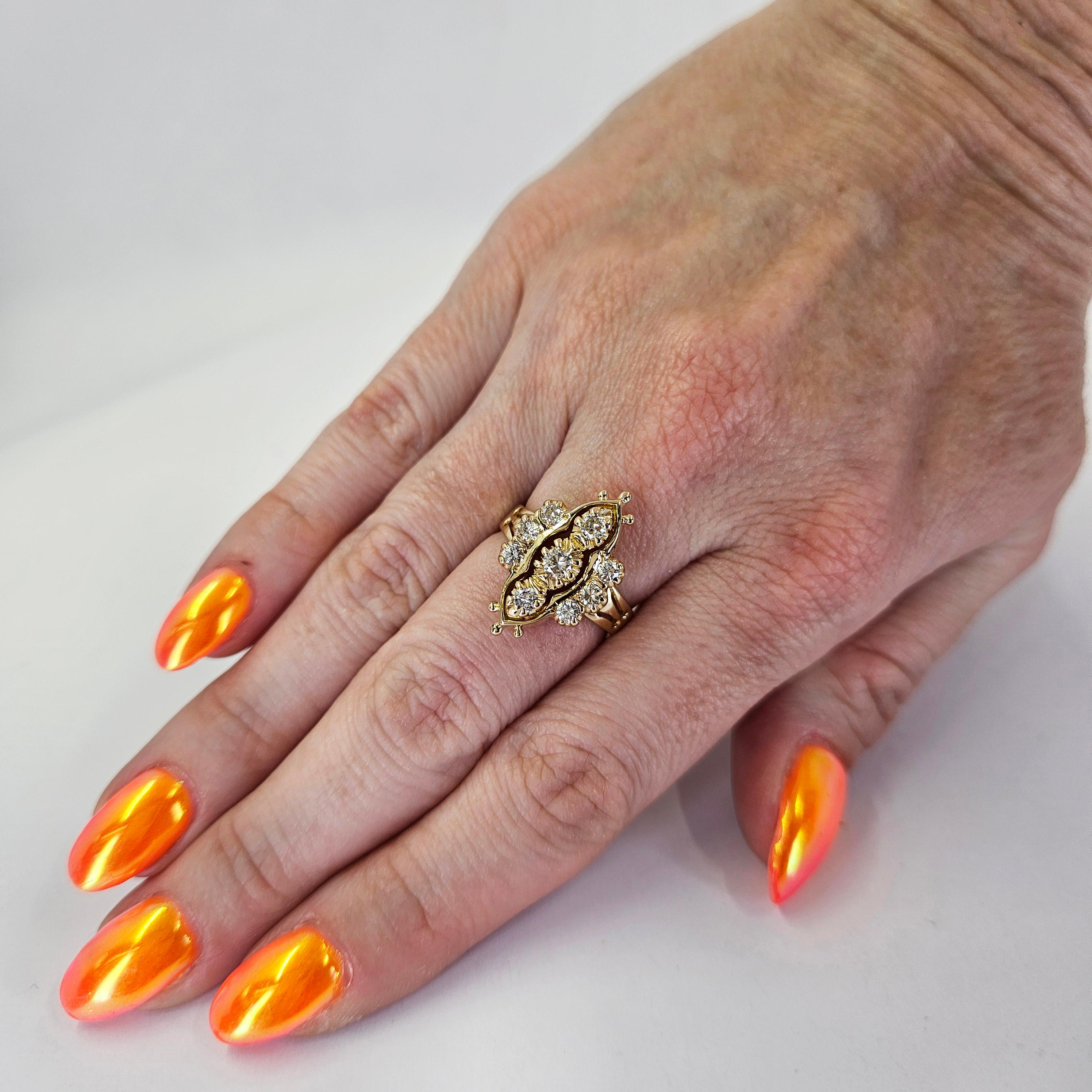 14 Karat Yellow Gold 1950s Dinner Ring Featuring 9 Round Brilliant Cut Diamonds of SI Clarity and H Color Totaling Approximately 0.50 Carats. Finger Size 5.75. Includes One Sizing Service Prior to Shipping, Upon Request. Finished Weight is 5.5 Grams.