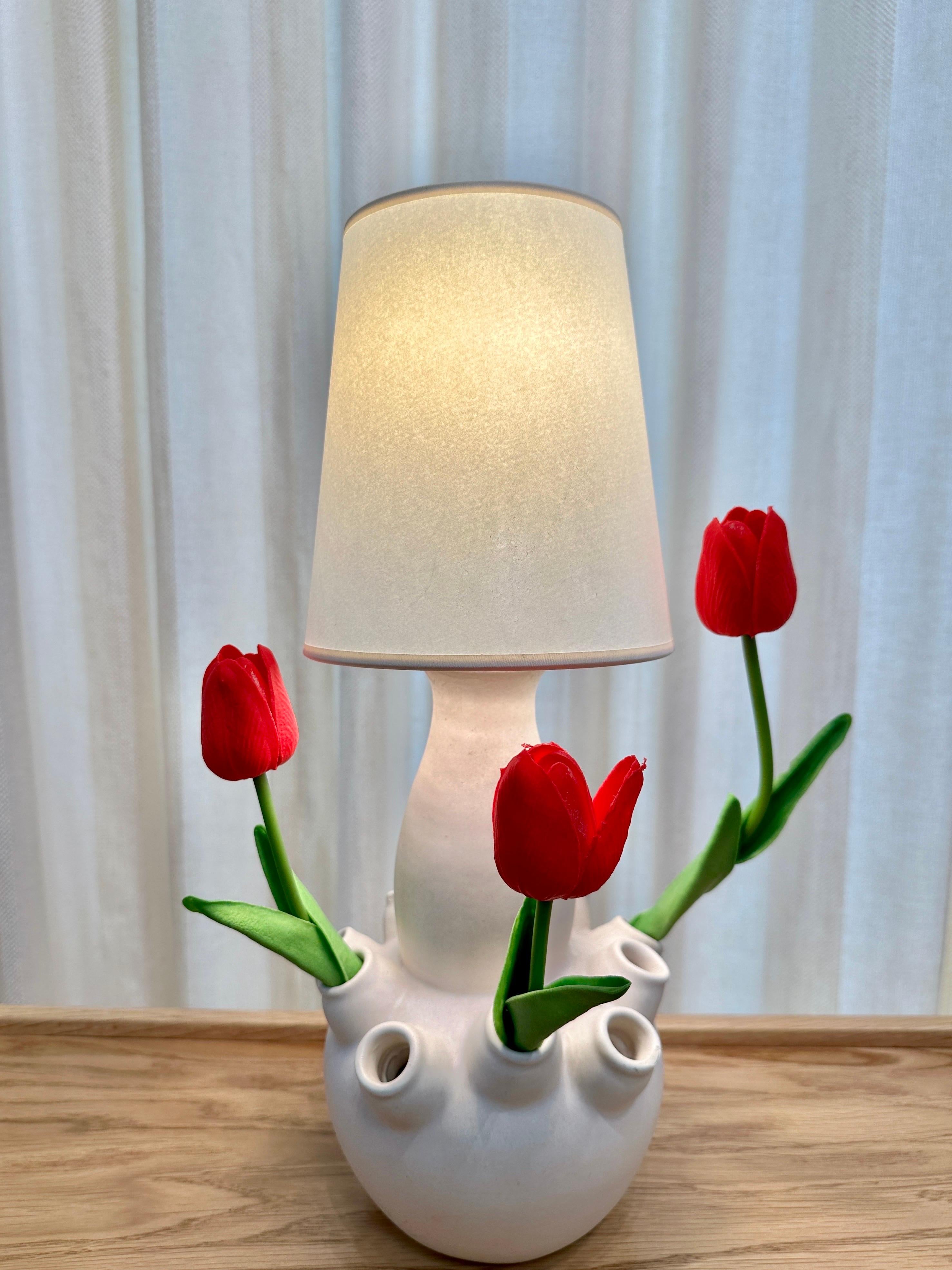 This is an amazing hand-crafted mid-century French Ceramic bud vase/ table lamp by Louis Giraud, Vallauris, 1950s.  It is usable as a flower vase with openings all around the base in creamy tone.  The lamp has been rewired to its original beauty and