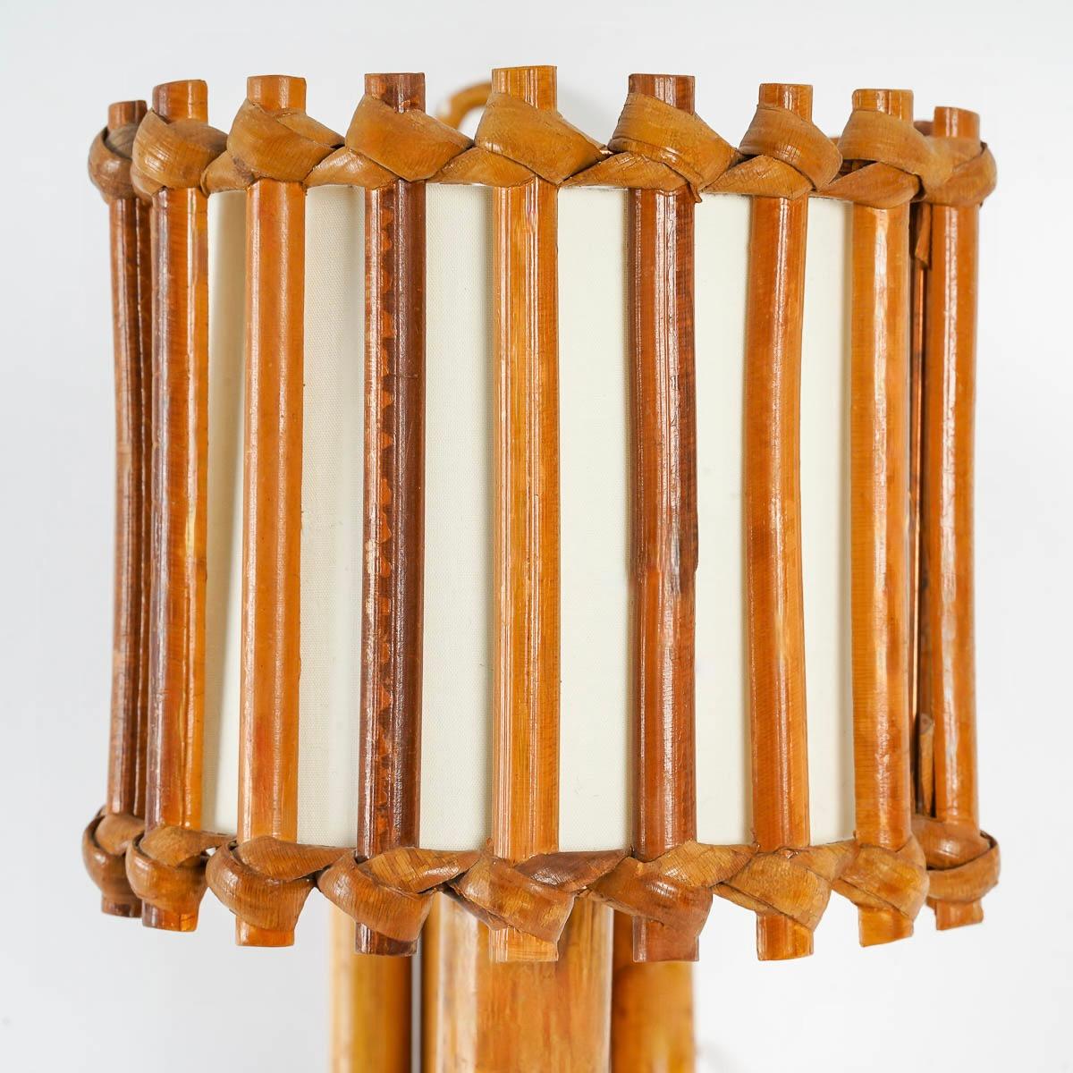 French 1950s, Louis Sognot Pair of Rattan Sconces