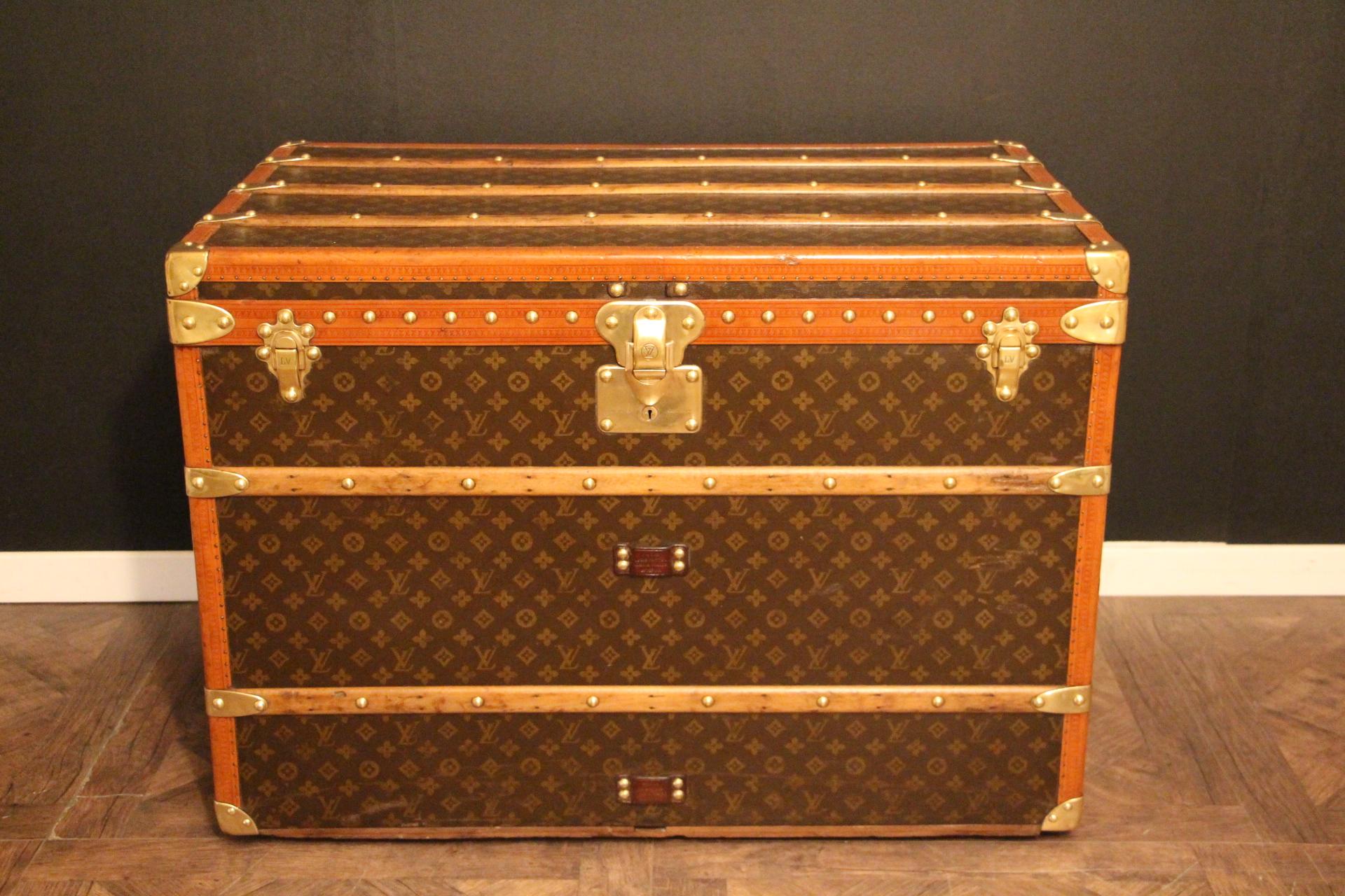 This superb Louis Vuitton steamer trunk features stenciled monogram canvas,honey color lozine trim, LV stamped solid brass locks and studs as well as leather side handles and brass corners. Its side handles have been replaced by new ones,exactly the