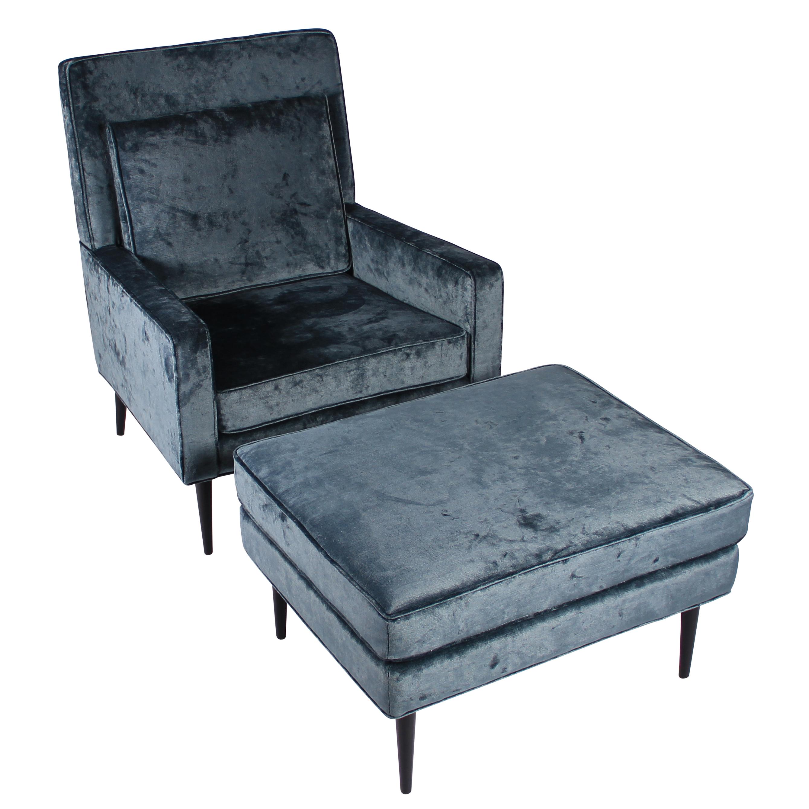 Beautifully scaled 1950s lounge chair and ottoman fully restored in a rich, steely-blue vintage-style velvet with new straps and foam, and newly ebonized tapered legs. Fabric swatch available. We are uncertain of the maker/designer, but this set is