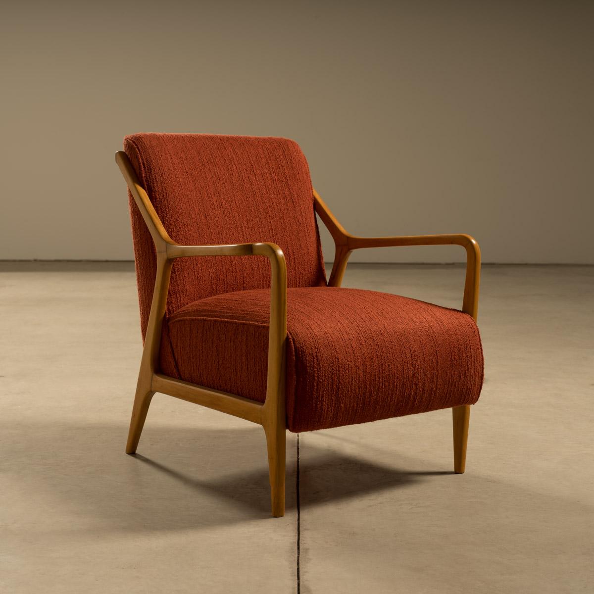 This mid-century lounge chair, designed by Italian-born Brazilian designer Giuseppe Scapinelli in the 1950s, exemplifies the bold yet elegant characteristics of his designs. Known for his sculptural approach to furniture, Scapinelli’s pieces stand