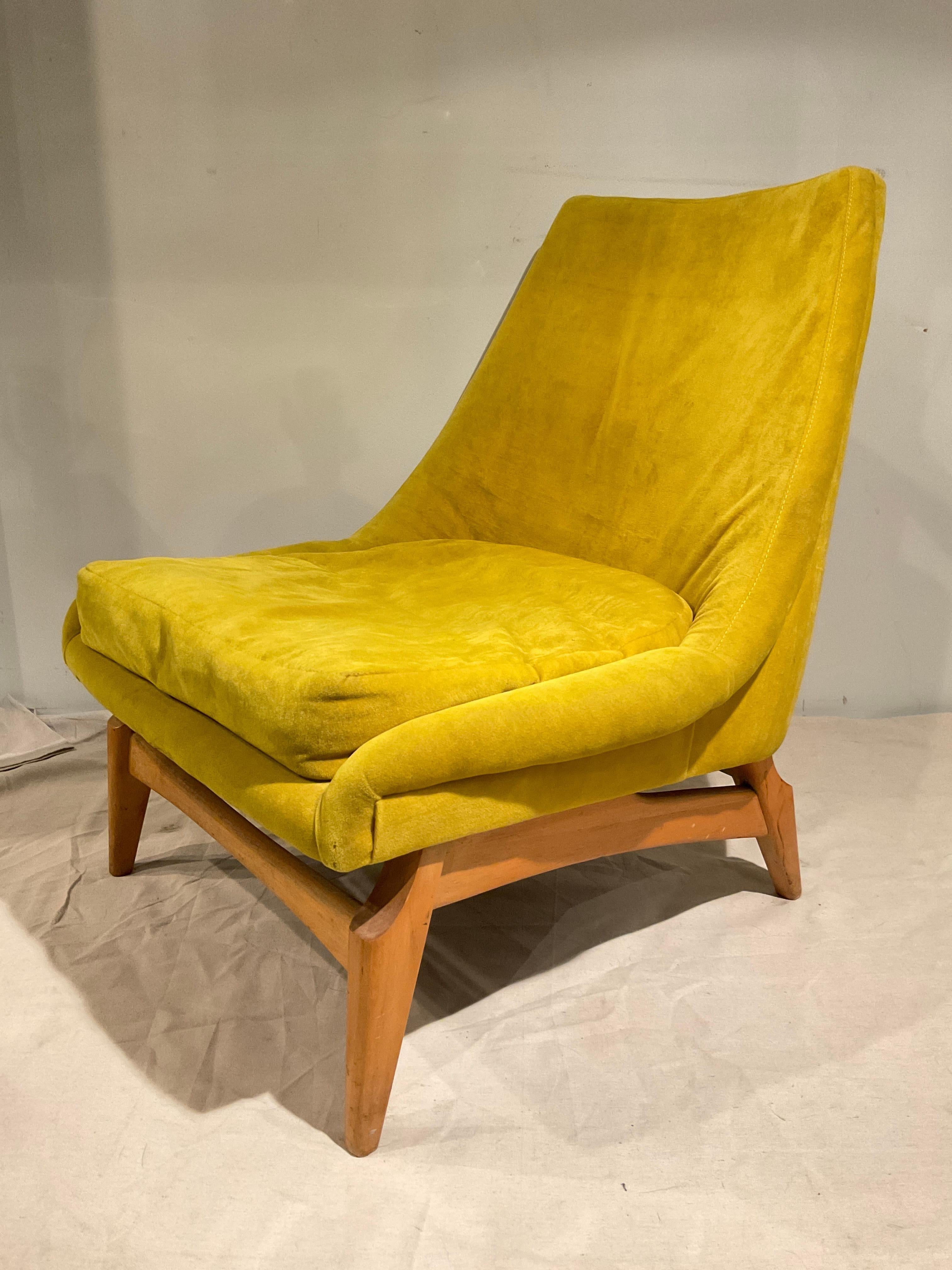 1950s Lounge chair. Needs reupholstering. Marks in finish on wood as seen in pictures.