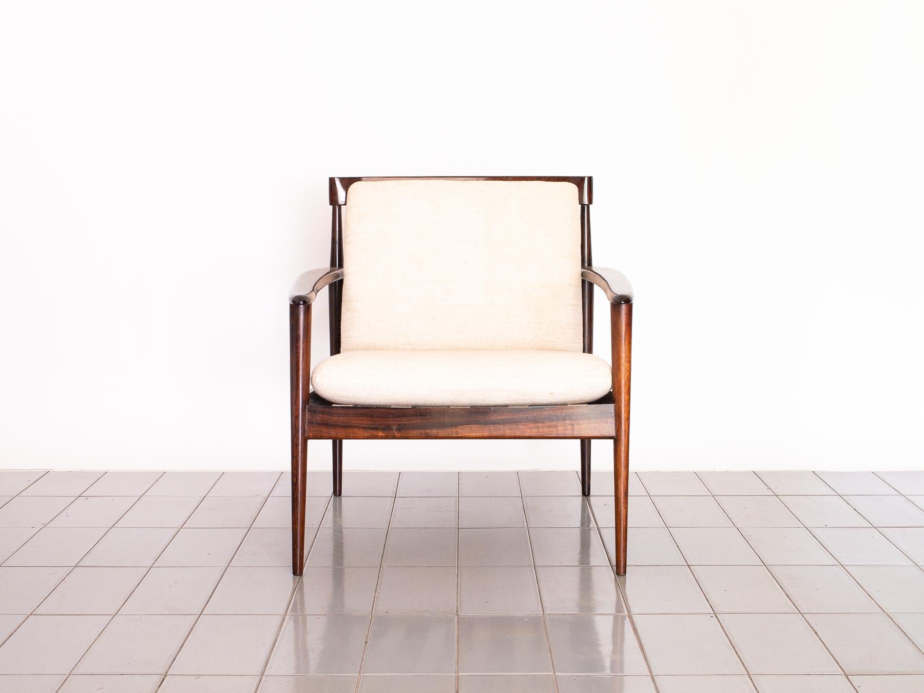 This amazing design was created by Grete Jalk and produced in Brazil by Móveis Ambiente. Cotton straps ensure maximum comfort. Brazilian rosewood ensures beauty and strength. This chair was the most used chair by master Architect Rino Levi