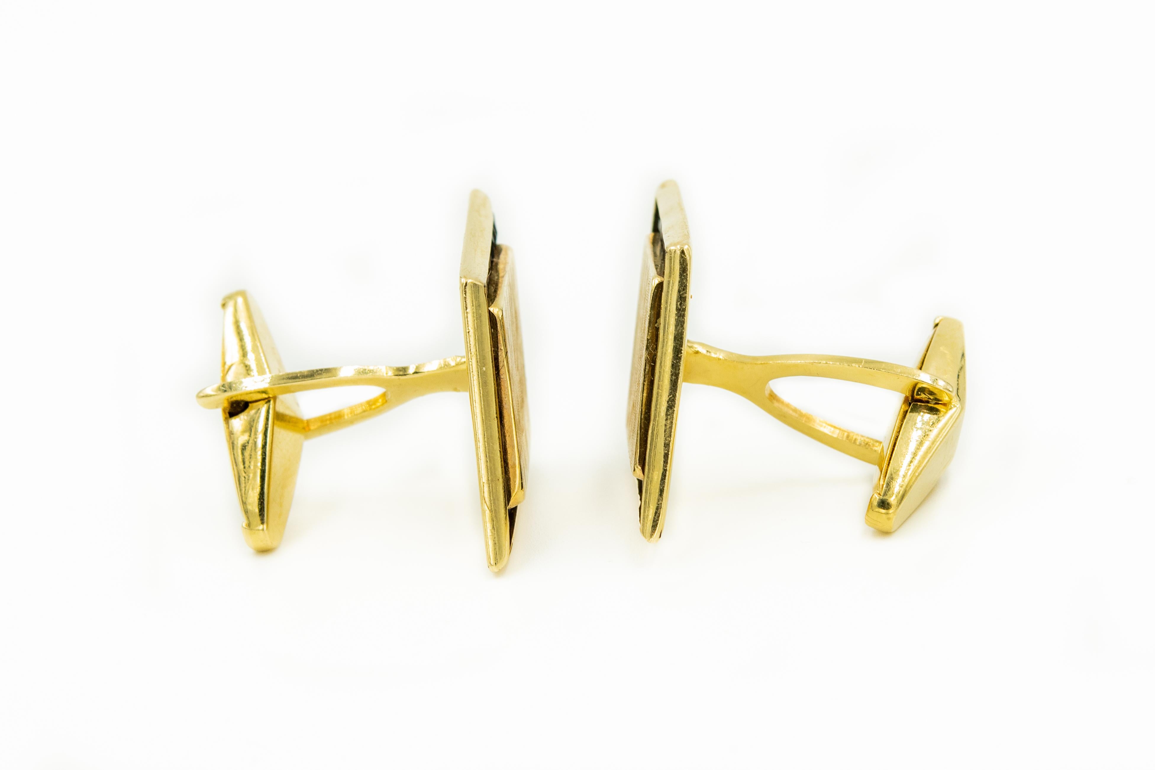 In 1944, Lucien Piccard began producing jewelry. These cufflinks featuring synthetic sapphires are one of the designs they were known for. The cuff links are 14k yellow gold with a florentine finished gold area in the middle where a monogram could