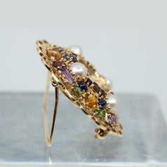 Años 50 LUCIEN PICCARD Broche de oro amarillo de 14 quilates con reloj de piedras preciosas multicolor