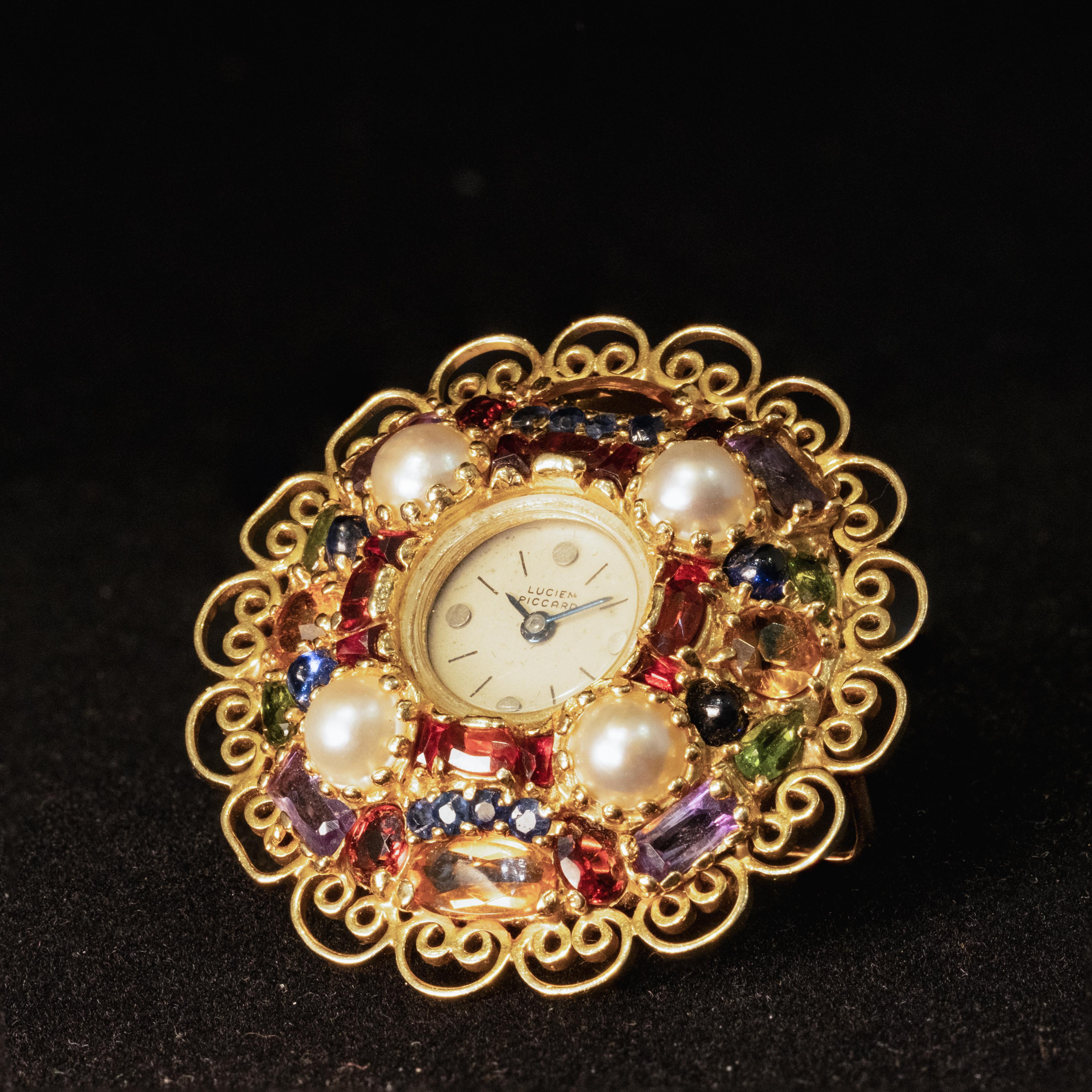 Años 50 LUCIEN PICCARD Broche de reloj de oro amarillo de 14 quilates con varias piedras preciosas en venta 1
