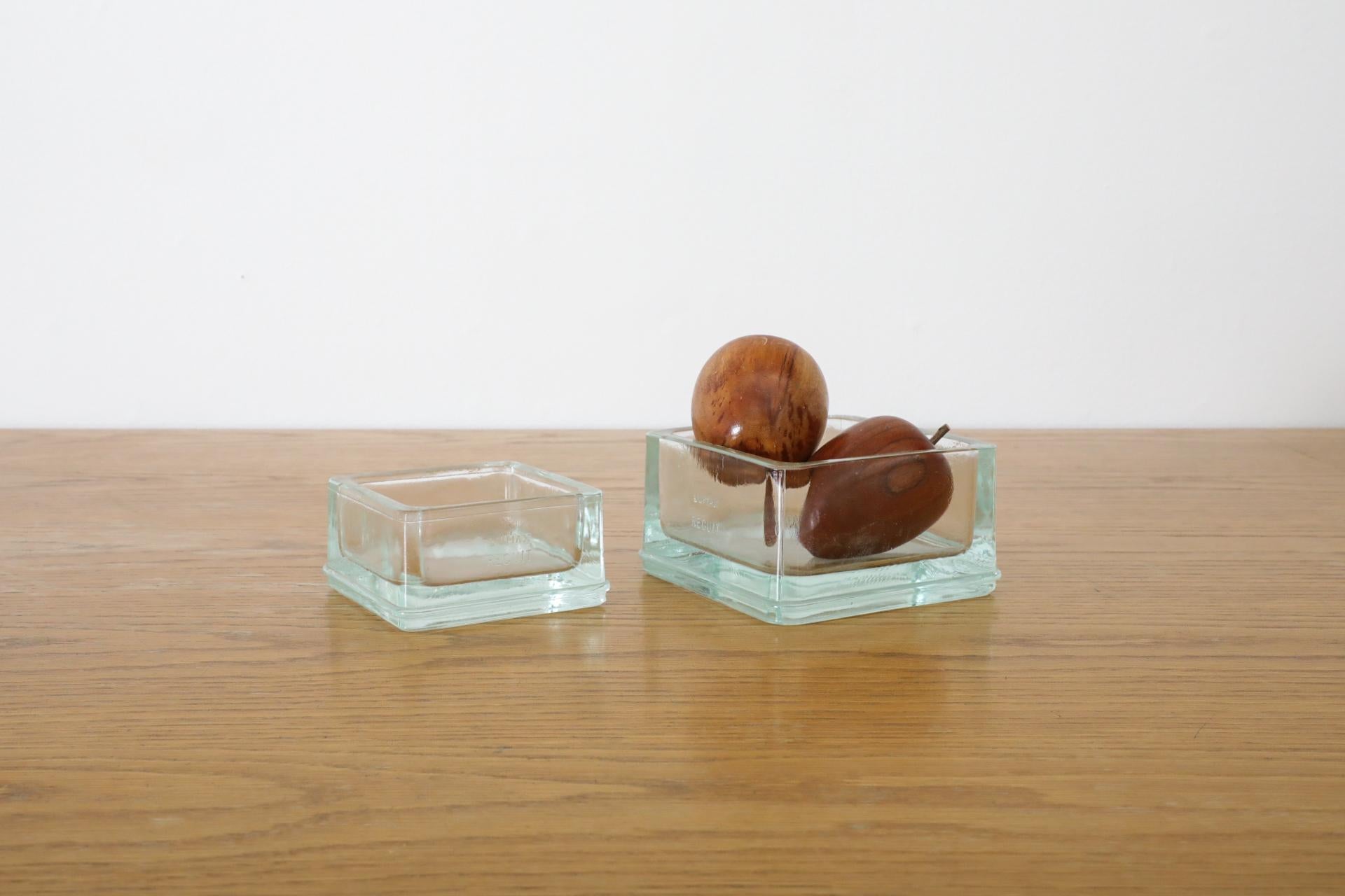 This is a rare, 1950's French Mid-Century accessory designed by the iconic Charlotte Perriand and equally legendary Le Corbusier and manufactured by Lumax in France. It is a thick, molded glass desk tidy/ashtray/catchall made in a striking