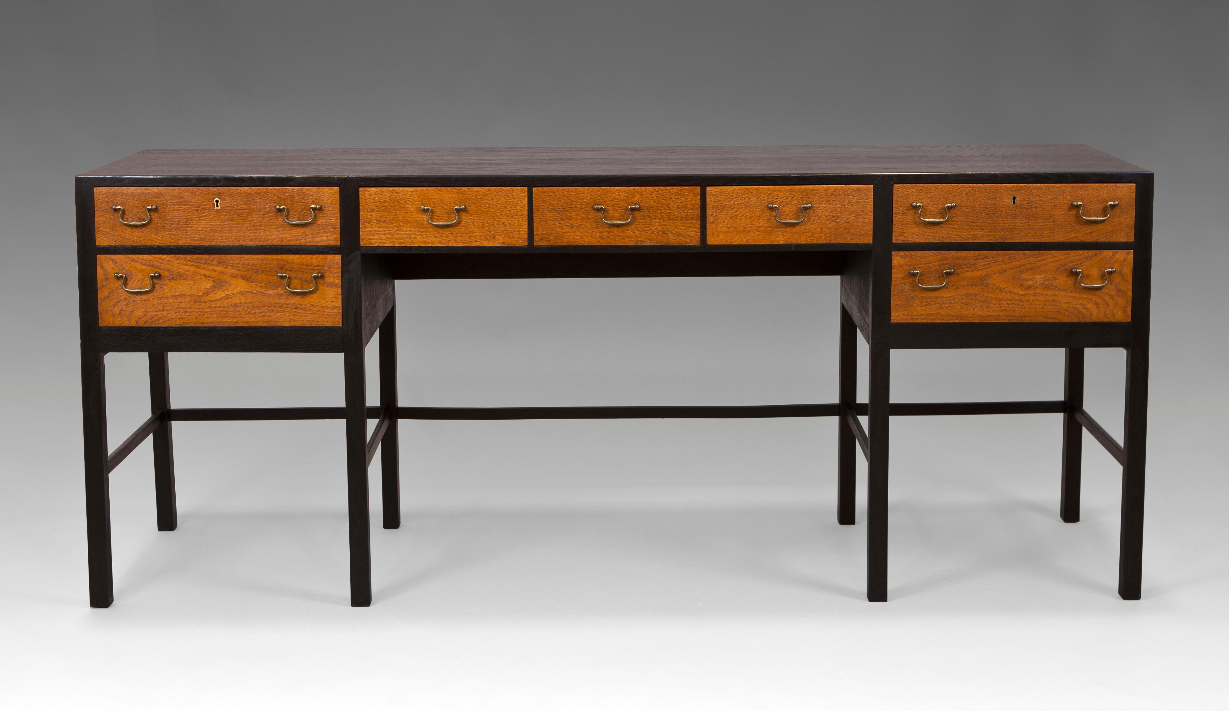Sideboard in oak and black stained oak with brass handles. Lysberg & Therp. Denmark, 1950s.
