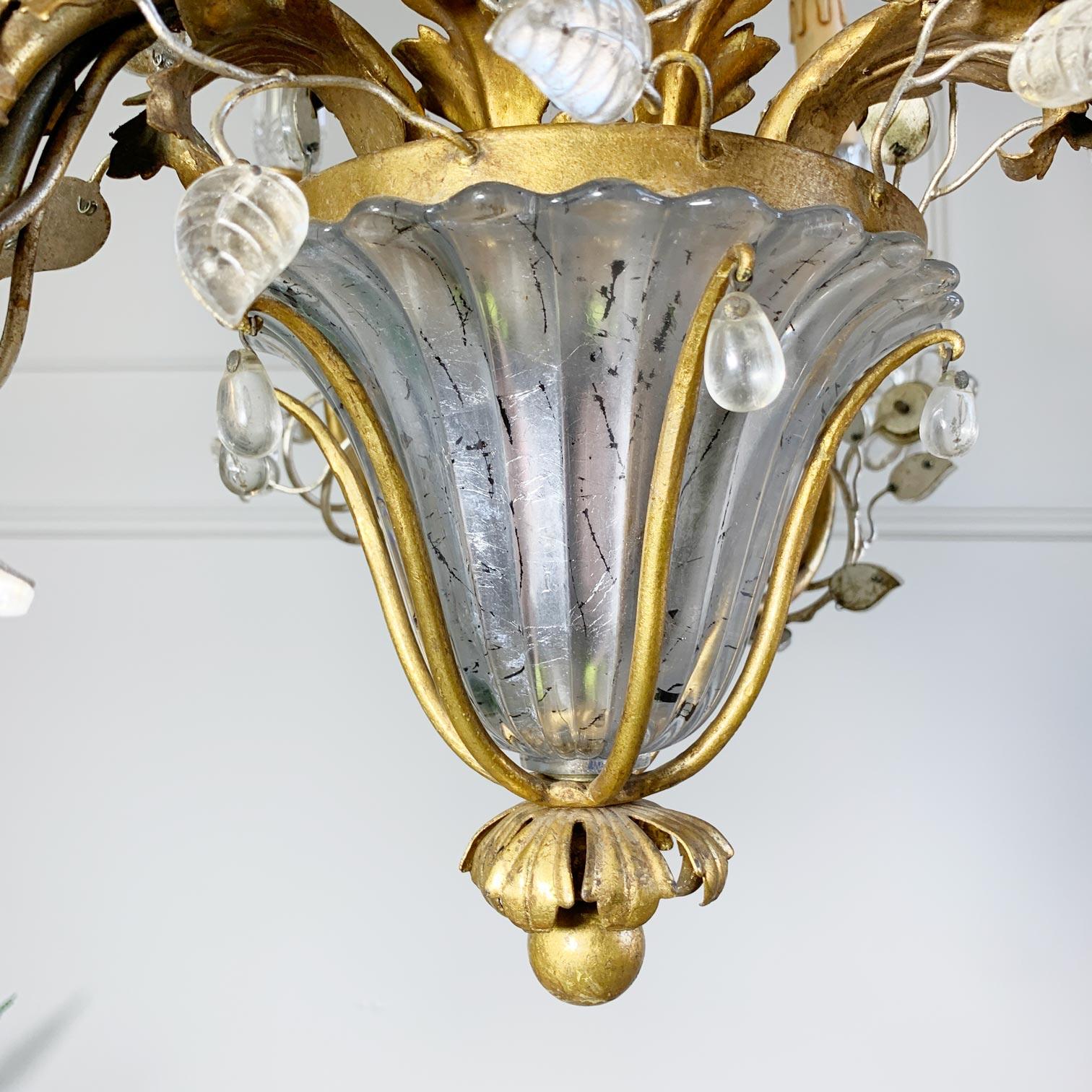 An exceptionally beautiful large Banci Firenze chandelier, gilt iron frame surmounted with crystal leaves and flowers that sit on spiralling golden gilt arms, within the lower area sits a large crystal vase shaped base, 

The chandelier has 6 single