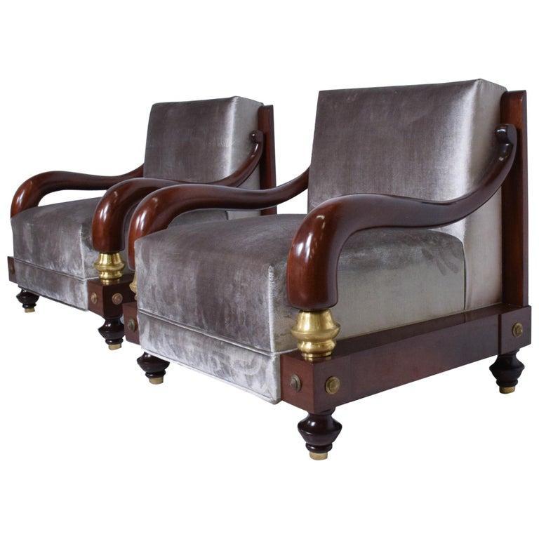 Two Armchairs by Octavio Vidales for Muebles Johrvy 
Mexican Modernism 1950s Mexico City
Features new upholstery gray-silver velvety fabric. 
Wonderful brass accents.
Wood base has gold leaf. 
30.5 H x 27D x 34 W, Seat 17 H Armrest 20.75