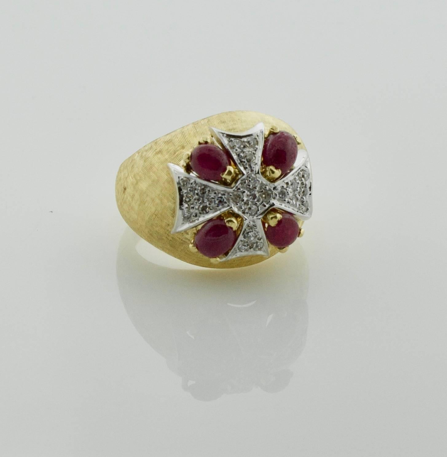 1950's Maltese Cross Diamond and Ruby Ring in 18k
Four Cabochon Pear Shaped Rubies  weighing 1.40 carats approximately
Twenty Three Round Diamonds weighing .45 carats approximately
size 6 3/4
The Maltese cross is a starlike symbol formed by four