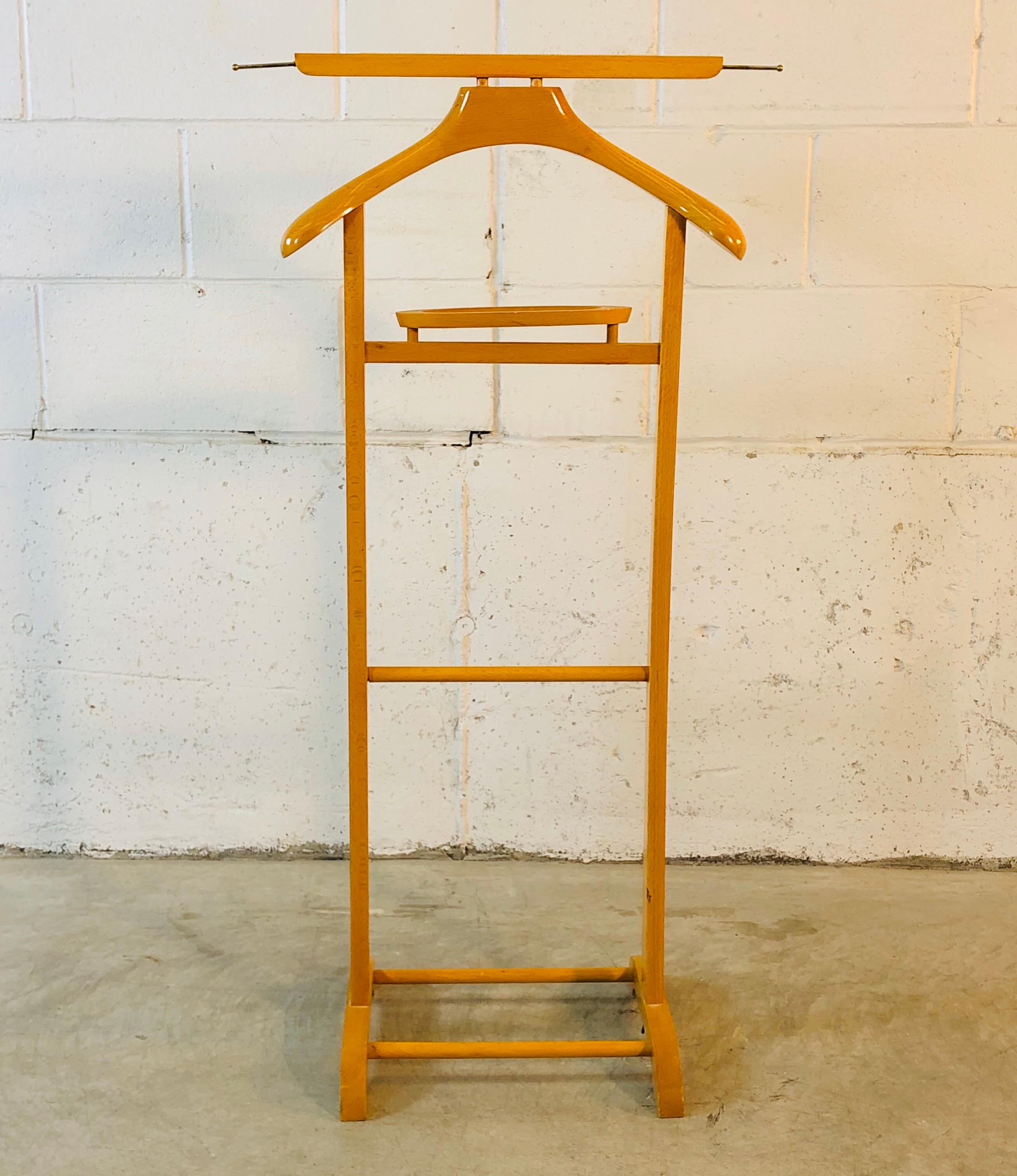 Vintage 1950s maple wood Italian men’s bedroom valet stand. The stand is marked Italy inside the change compartment. Nice high glass finish. Marked.