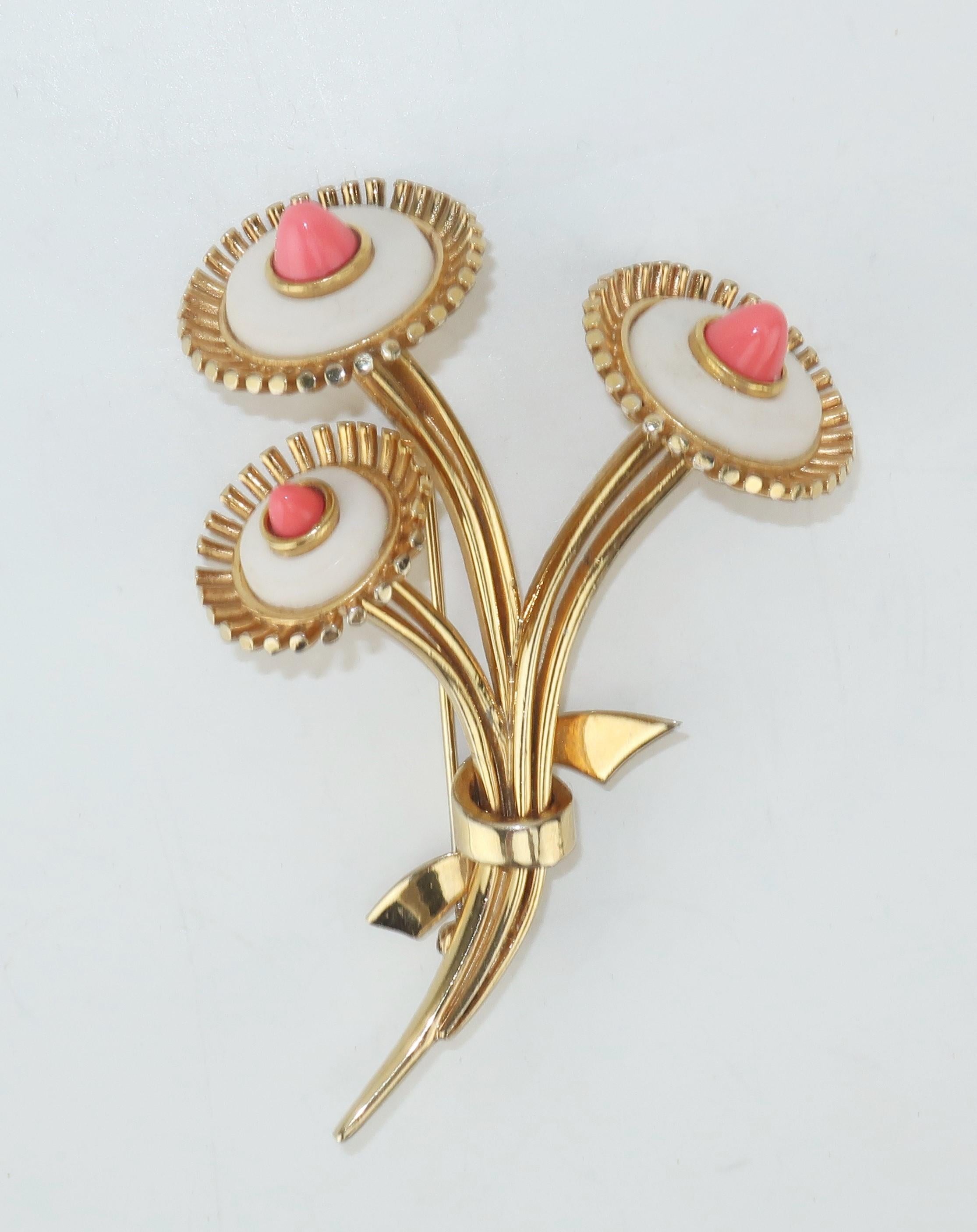Get a touch of vintage and all the majestic influence of Spring with this 1950's Marcel Boucher gold tone floral brooch.  The detailed design incorporates faux coral cone-shaped stones offset by a matte white embellishment that replicates marble. 