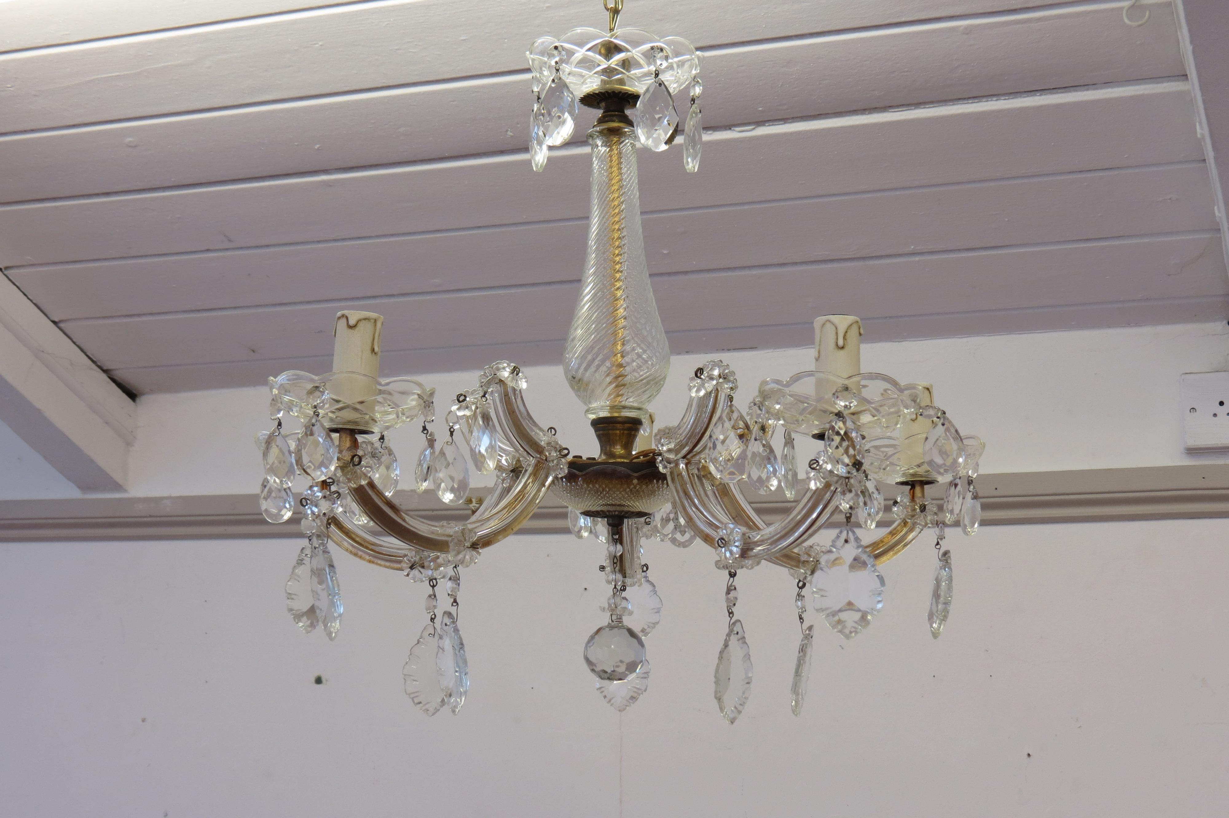 5-light Maria Theresia chandelier, 1950s
Metal frame with brass, glass crystal leaves and glass pears. 
Fully restored. 
