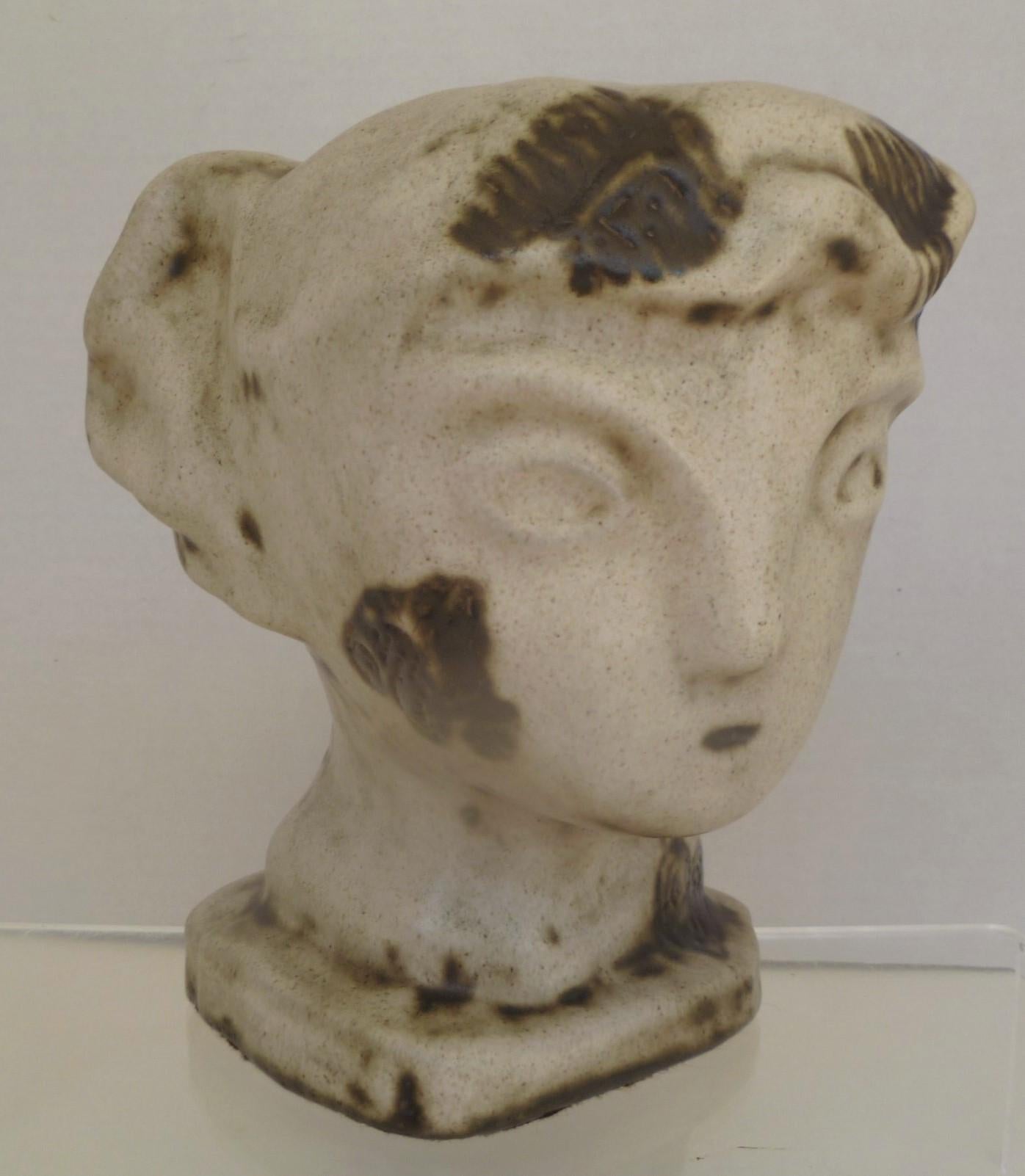 A rare and unique head sculpture from artist Marianna von Allesch. The depiction, a woman, brings to mind early Greek and Minoan forms. This head sculpture is approximately 8 inches tall and about 7 inches in diameter around the top of the head. A