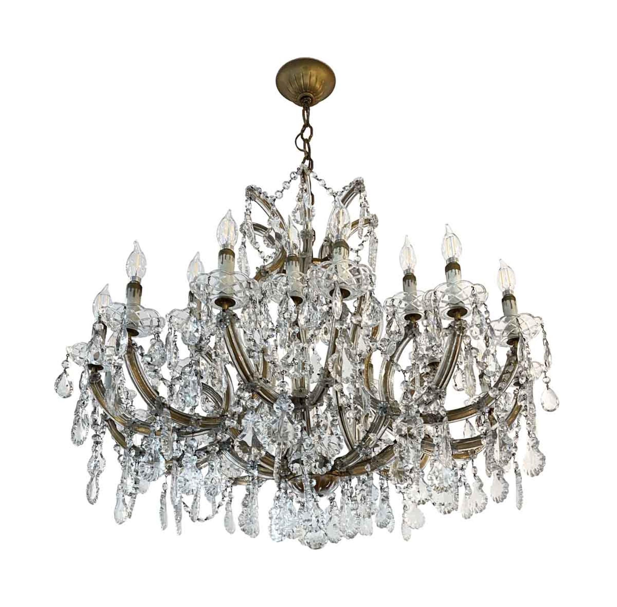 Spectacular 1950s antique 22-light Marie Therese crystal chandelier, with 21-light on the arms, and one-light in the center of the chandelier. This was acquired from an apartment in the 400 block of Park Ave in Manhattan. The bobeches have an etched