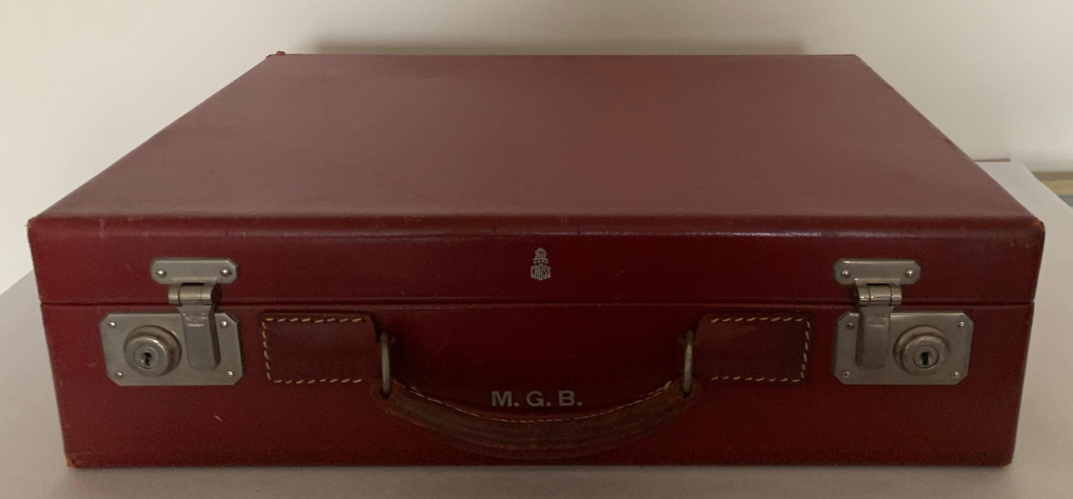 1950s red leather travel suitcase by Mark across. Ruby red smooth calf leather with tan fabric interior.