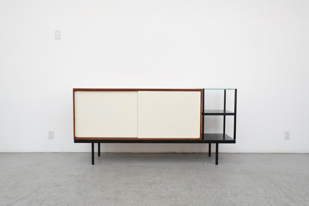 Rare, asymmetrical, Bornholm KW63 modular storage system with two sliding doors and a metal and glass side cubby. Designed by Martin Visser, 1950s, for 't Spectrum. Storage cabinets have white painted wood doors and interior shelving. In lightly
