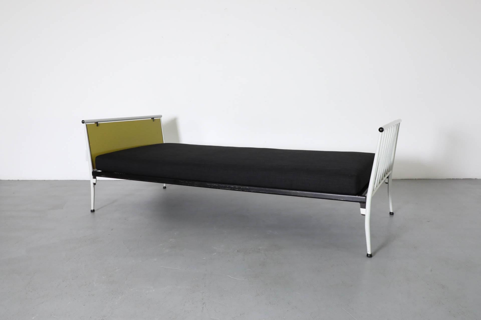 Dutch Mid-Century, 1950s Mategot inspired single bed designed by Wim Gilles for Dutch company RAdemakers WInschoten (or RAWI as it was more popularly named). Gorgeously designed with a lovely use of contrasting color and visually delicate, almost