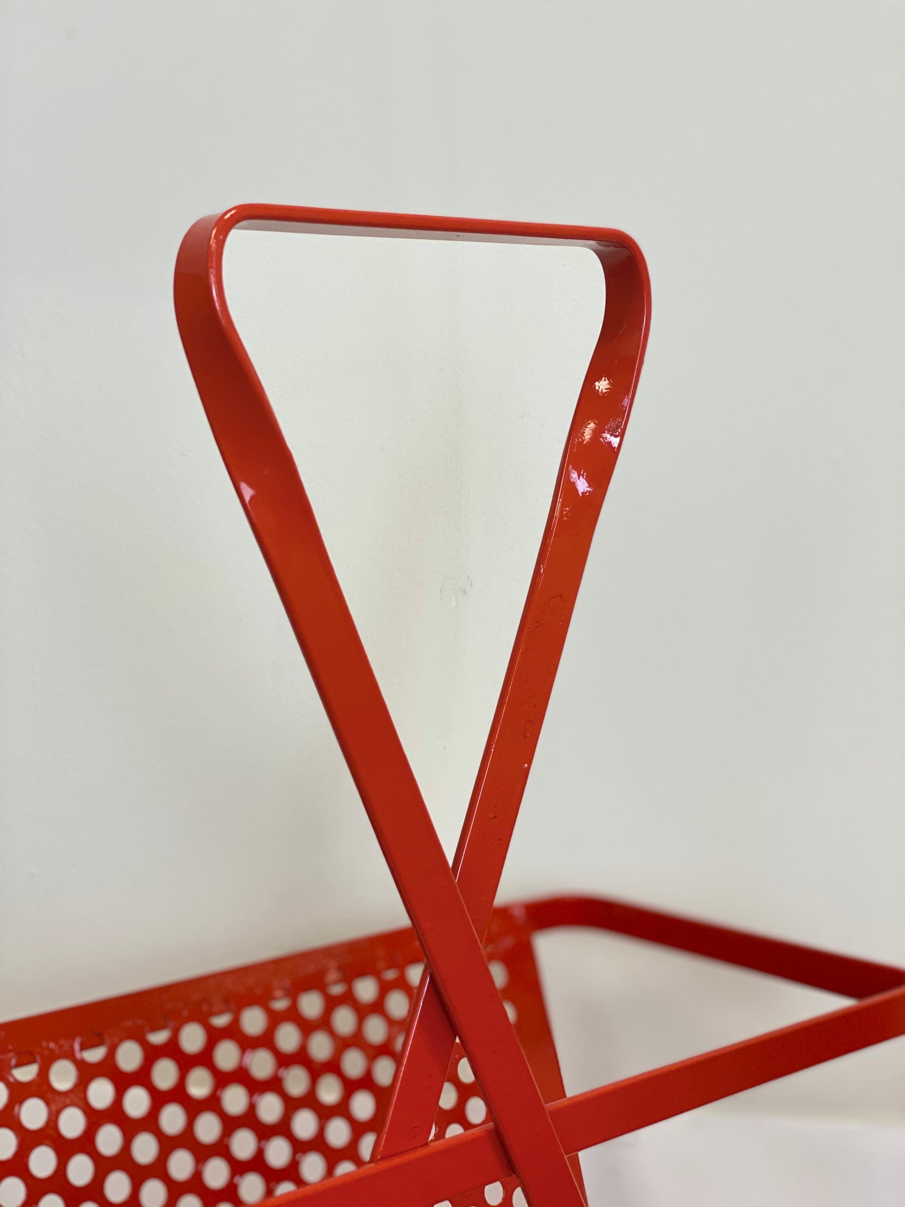 1950s Mathieu Matégot Red Perforated Metal Magazine Rack In Good Condition For Sale In Farmington Hills, MI