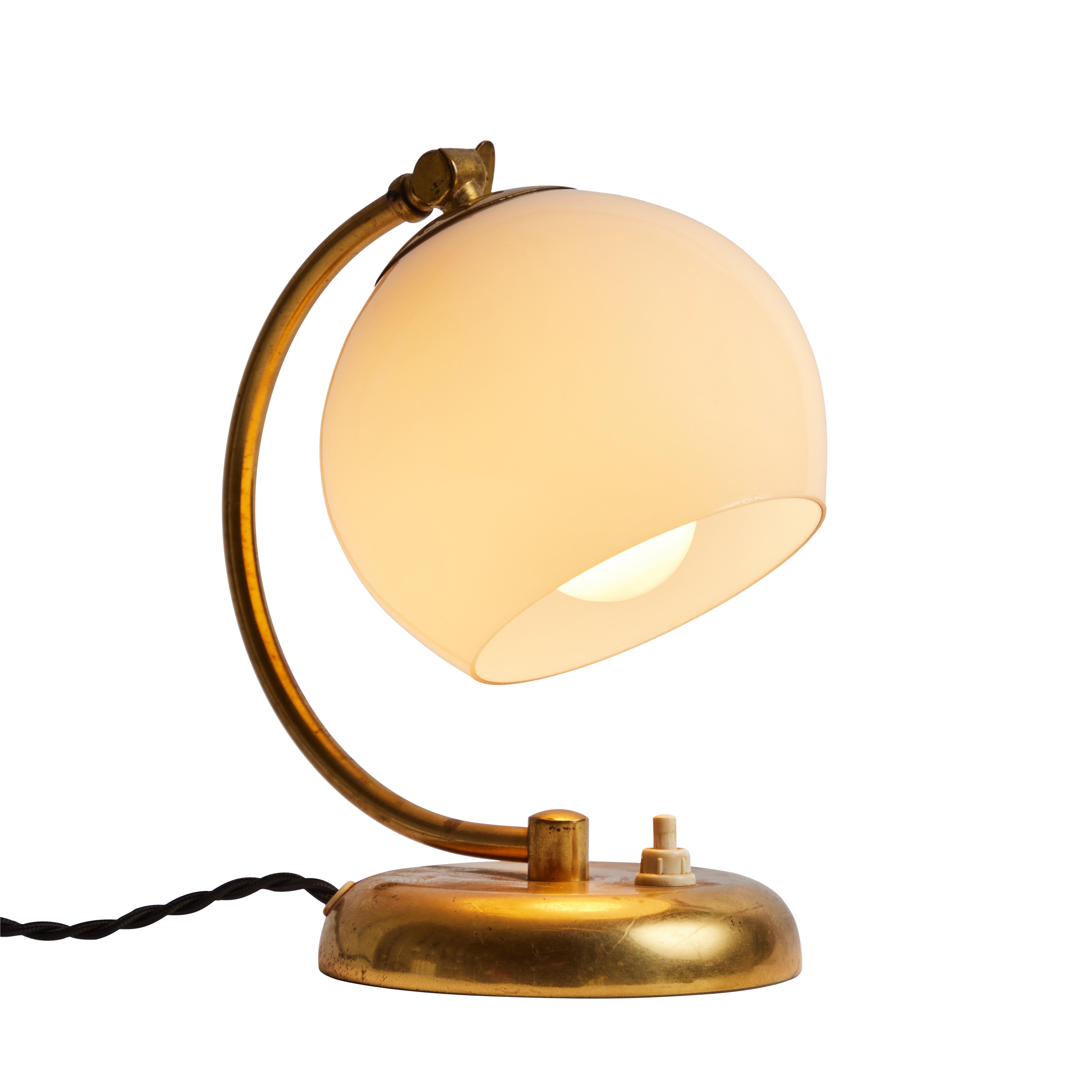1950s Mauri Almari brass and opaline glass table lamp for Idman. 

A rare and elegant lamp executed in brass and blown opaline glass. A contemporary of Paavo Tynell, Almari's refined work has made him an increasingly valued finish designer in