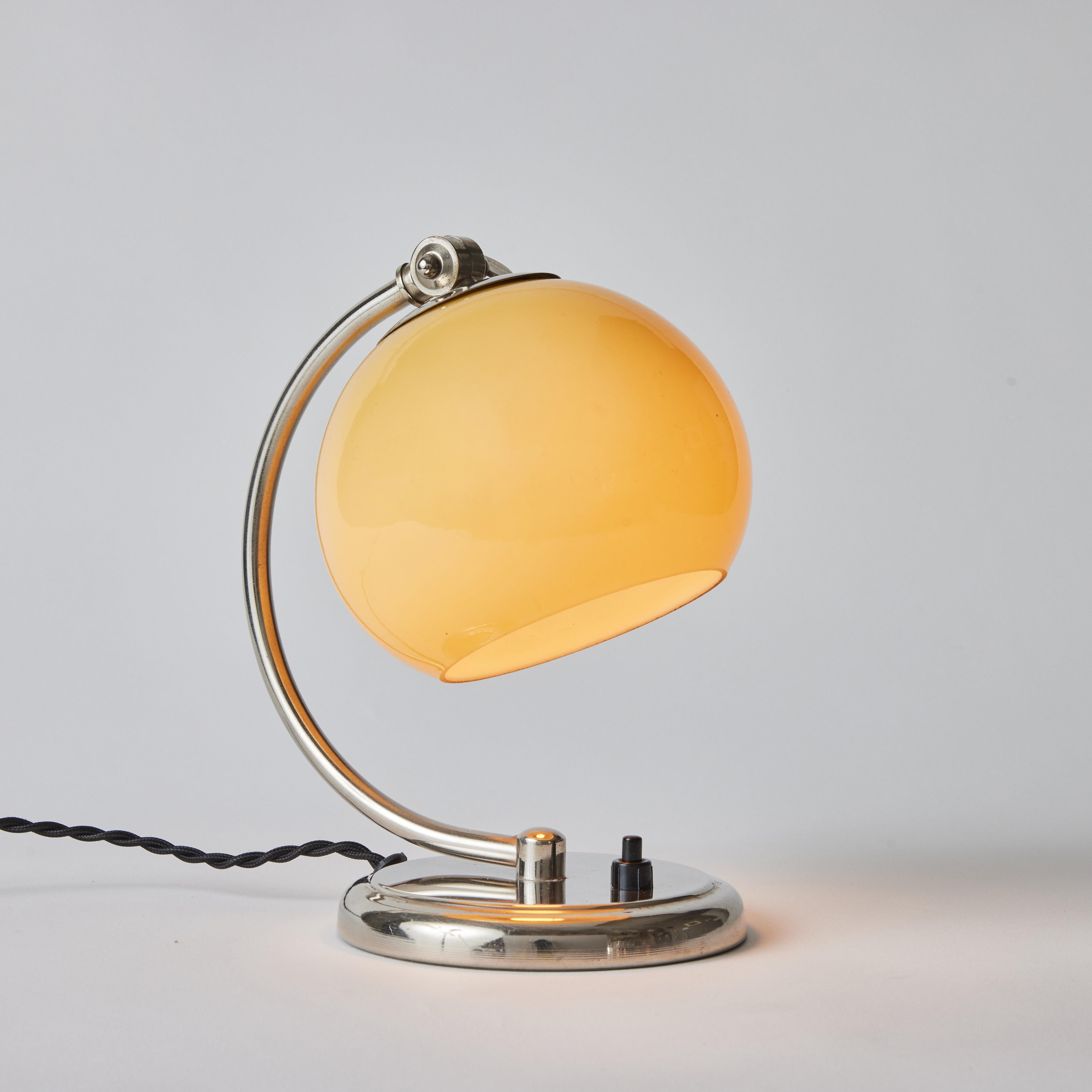 1950s Mauri Almari chrome and opaline glass table lamp for Idman. 

A rare and elegant lamp executed in chromed metal and blown opaline glass. A contemporary of Paavo Tynell, Almari's ultra refined work has made him an increasingly valued Finnish