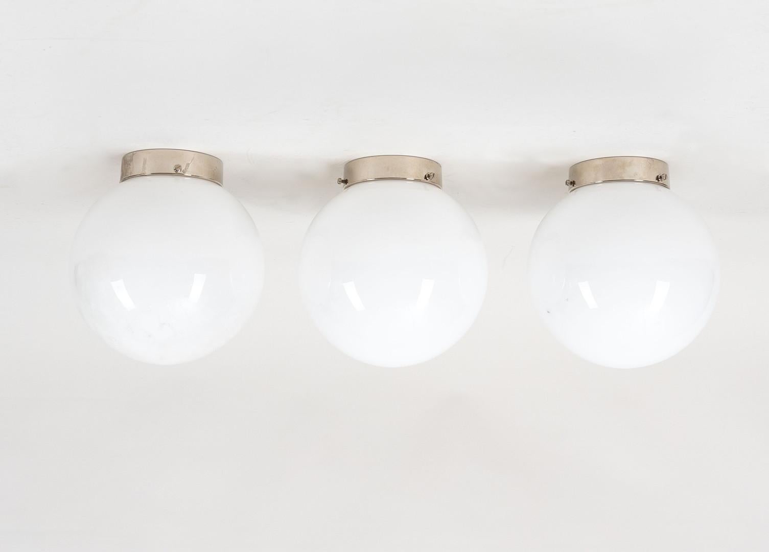 1950s Mauri Almari glass & metal wall or ceiling lamp for Itsu. Produced in Finland in the early 1950s and in the manner of Paavo Tynell. A rare and elegant set executed in thick opaline glass and metal. An esteemed contemporary of Paavo Tynell, the