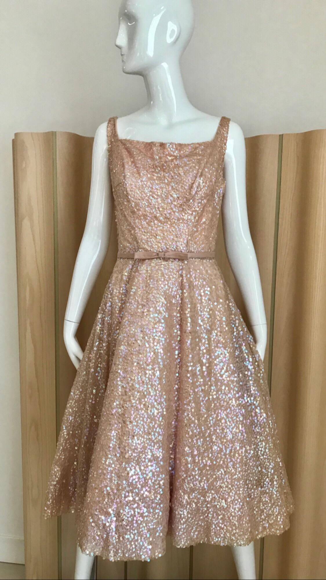Elegant 1950s Maurice rentner light creme cocktail dress with iridescent sequin. Dress comes with silk belt. 
Size: 4 / small
Measurement: 
Bust: 34 inches / Waist : 26 inches / 
dress length: 44.5 inches