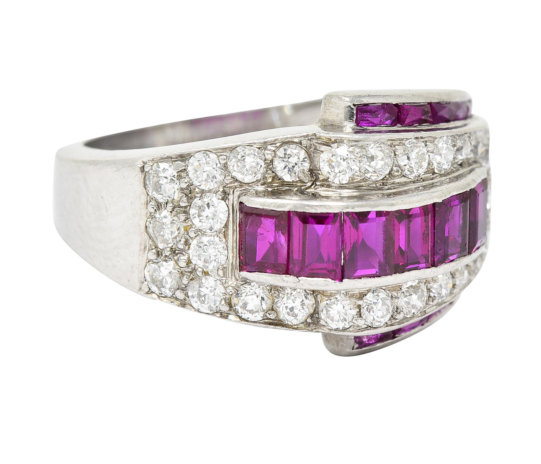 Band ring is designed as dynamically formed ridges. Centering channel set baguette cut rubies - saturated purplish red in color. Flanked North and South by channels of calibrè cut rubies - well matched to center. Weighing collectively approximately
