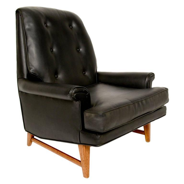 Handsome Heritage Black Faux Leather Lounge Chair 
Edward Wormley for Dunbar Furniture Era Classic 1950s
Faux leather that really looks like leather.
Comfort and good looks perched on a strong mahogany wood base.
Signed Heritage label
32.5 W x 35.5