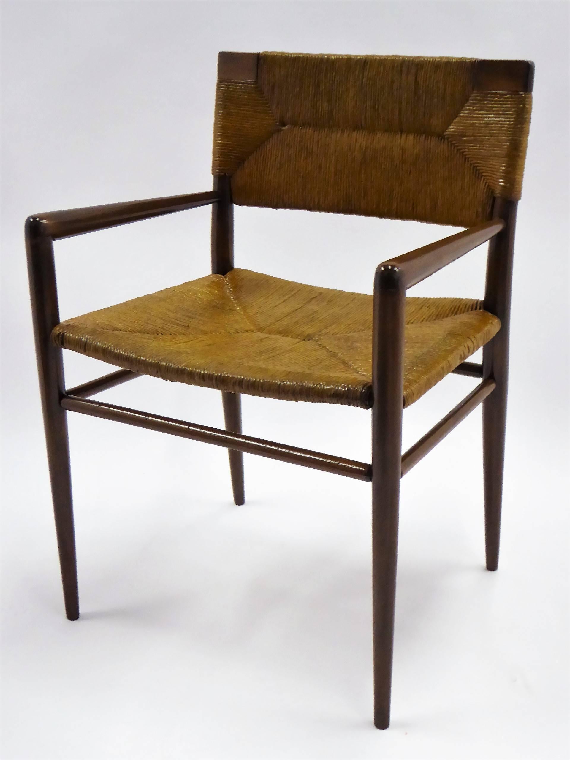 Designed in 1956 by Mel Smilow, this armchair in walnut with a woven rush seat and back. In restored condition, a midcentury Classic with beautiful sculpted lines. A wonderful Scandinavian modern side chair or lounge chair.
Measurements: 22 inches