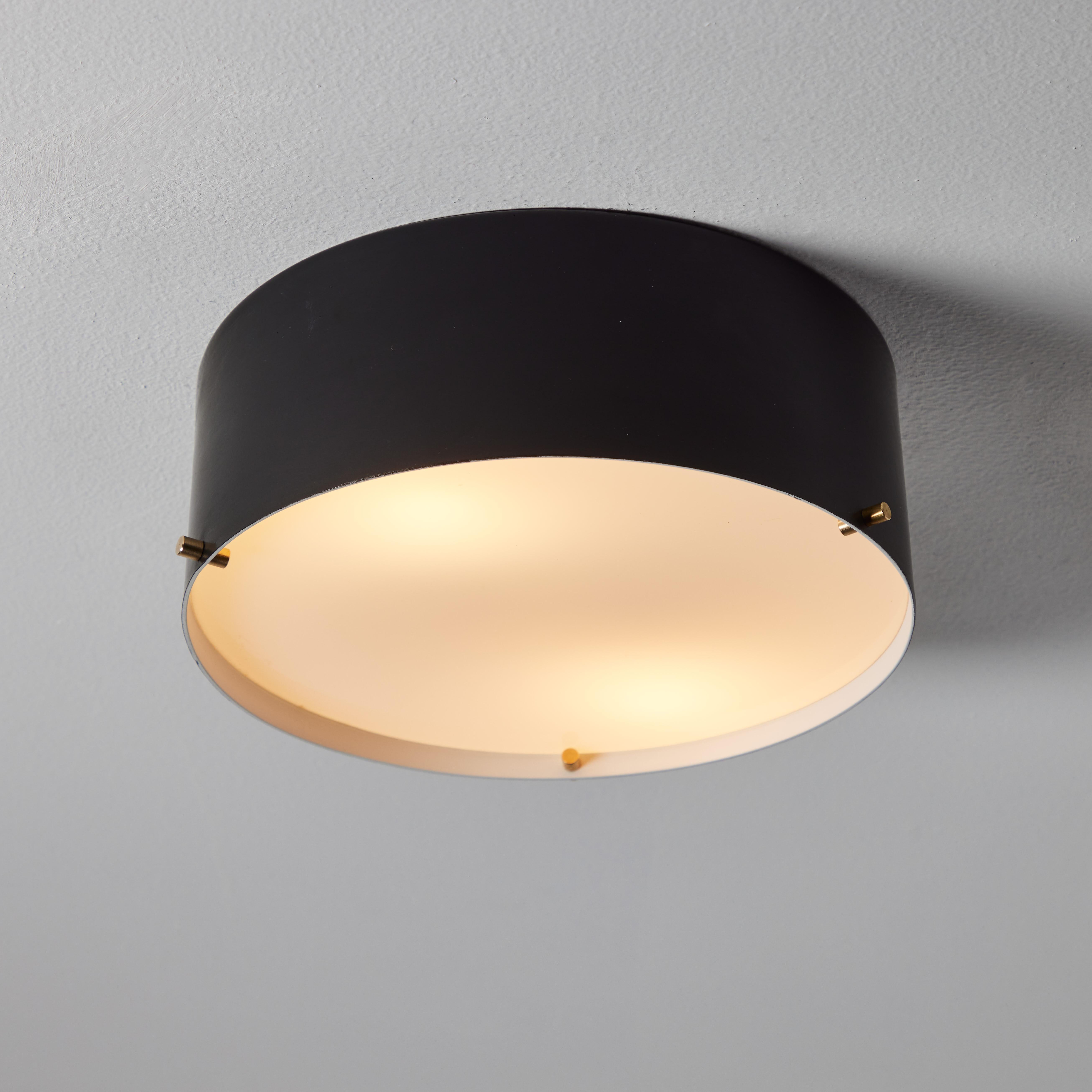 1950s Metal and Glass Ceiling Lamp by Bruno Gatta for Stilnovo. A quintessentially 1950s Italian design executed in opaline glass, black painted metal and brass mounting screws. A highly functional and sculptural flush mount of attractive scale and