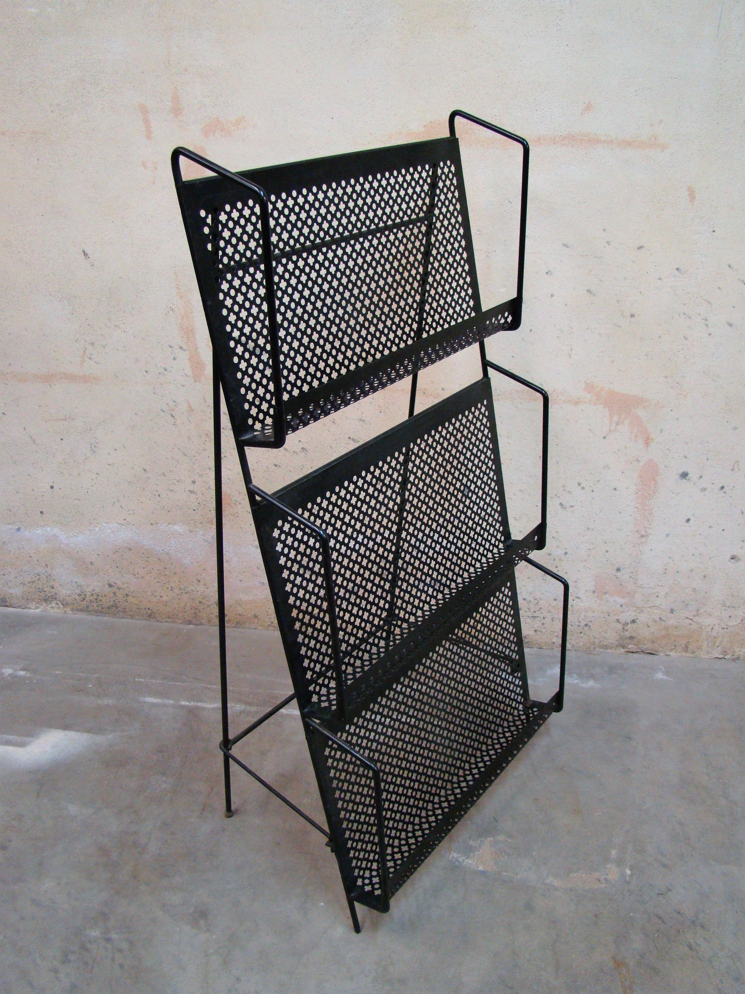 1950's folding magazine display stand constructed from Iron and stamped metal in the 