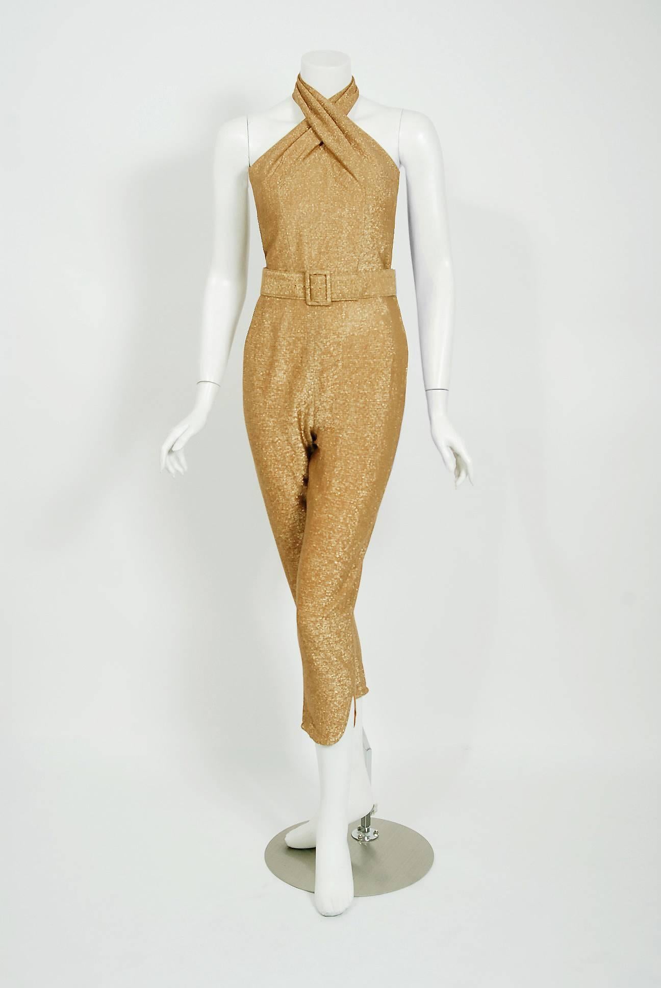 Words can not describe how beautiful this 1950's Gotham Original designer jumpsuit ensemble is! It's fashioned from fully-lined sparkling metallic gold lurex. It is cut in that classic pin-up bombshell style; all curves and sexiness. The blouse has