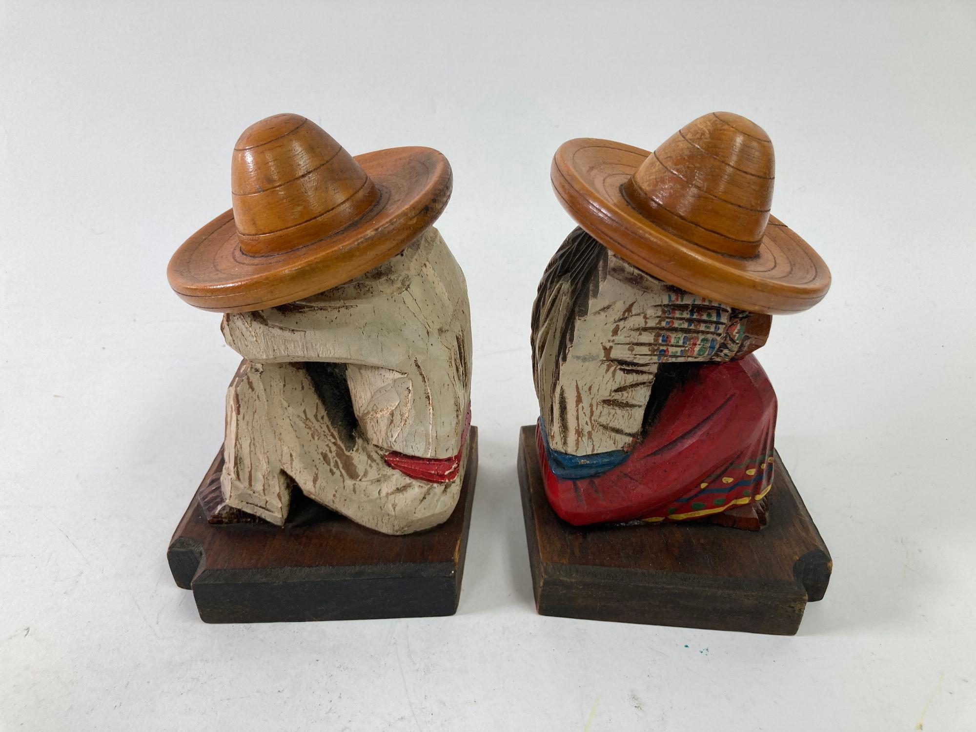 A pair of vintage 1950s North American Mexican handmade polychrome painted wood 