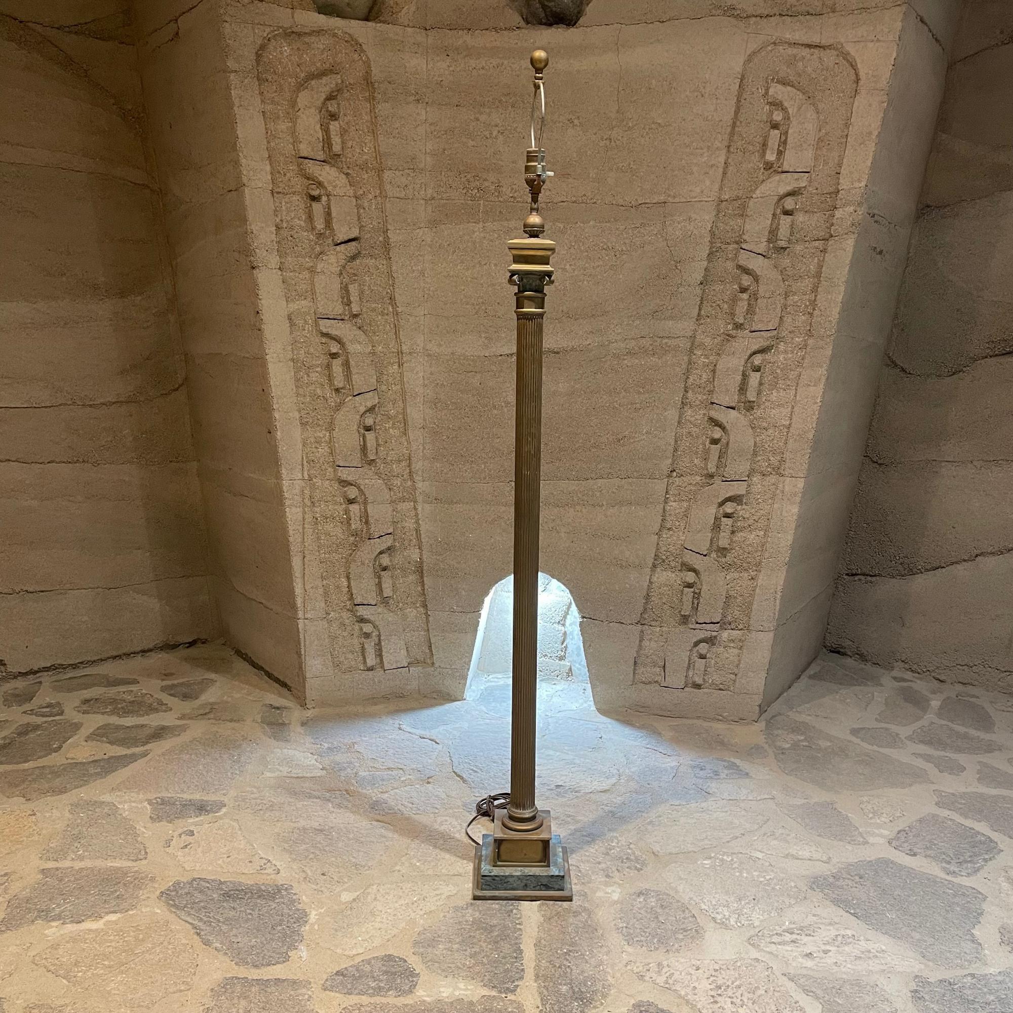 1950s Mexican Modernist neoclassical column floor lamp in patinated bronze and green marble with regal Roman detail 
Attributed to the design style of Arturo Pani. Unmarked.
Mexican neoclassical column floor lamp with regal Roman