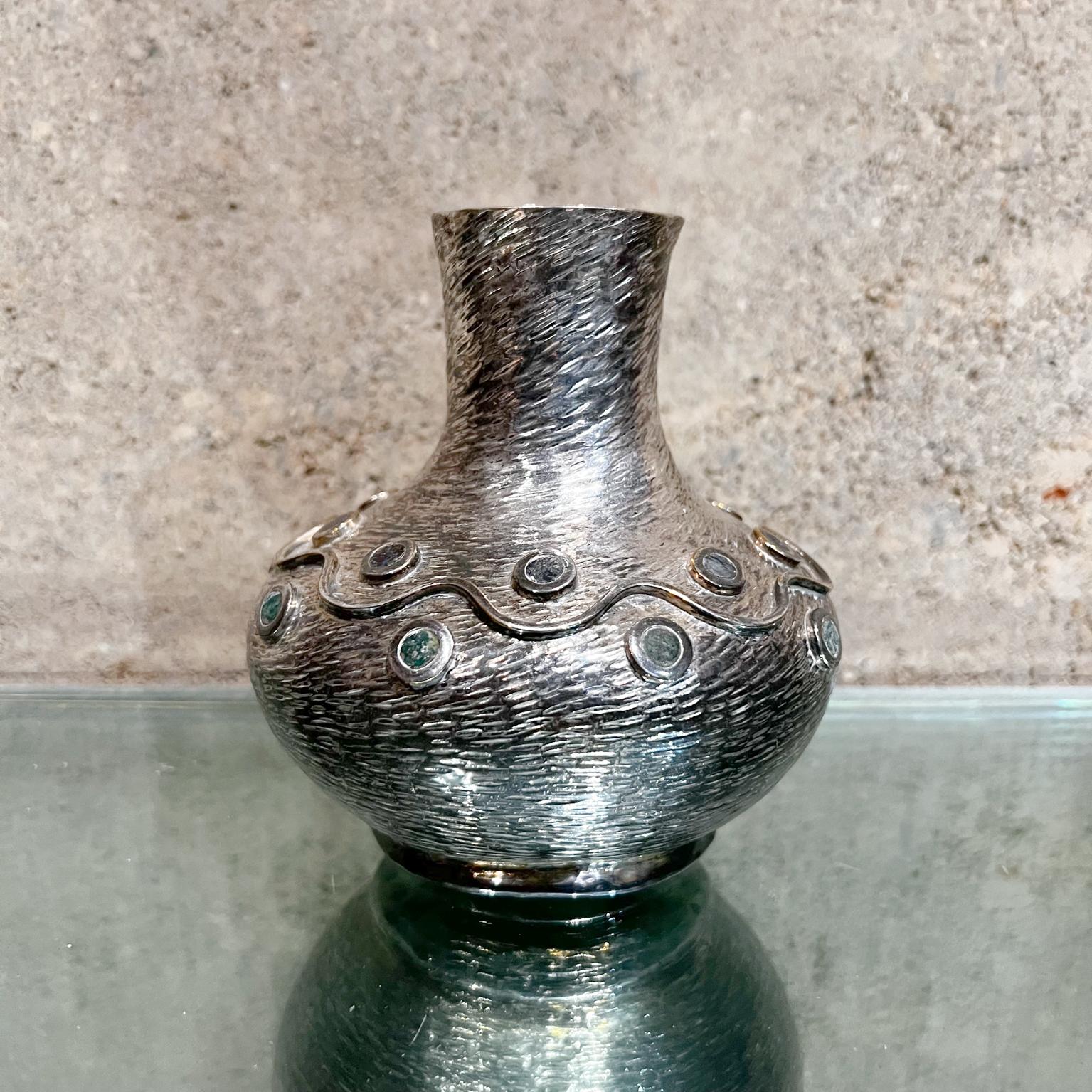 1950s Los Castillo modern silver vase from Mexico
Finely crafted hand-wrought silver over copper with abalone inlay detail. 
Signed Los Castillo Taxco Mexico.
5 tall x 5 diameter
Preowned original unrestored vintage condition.
Review images