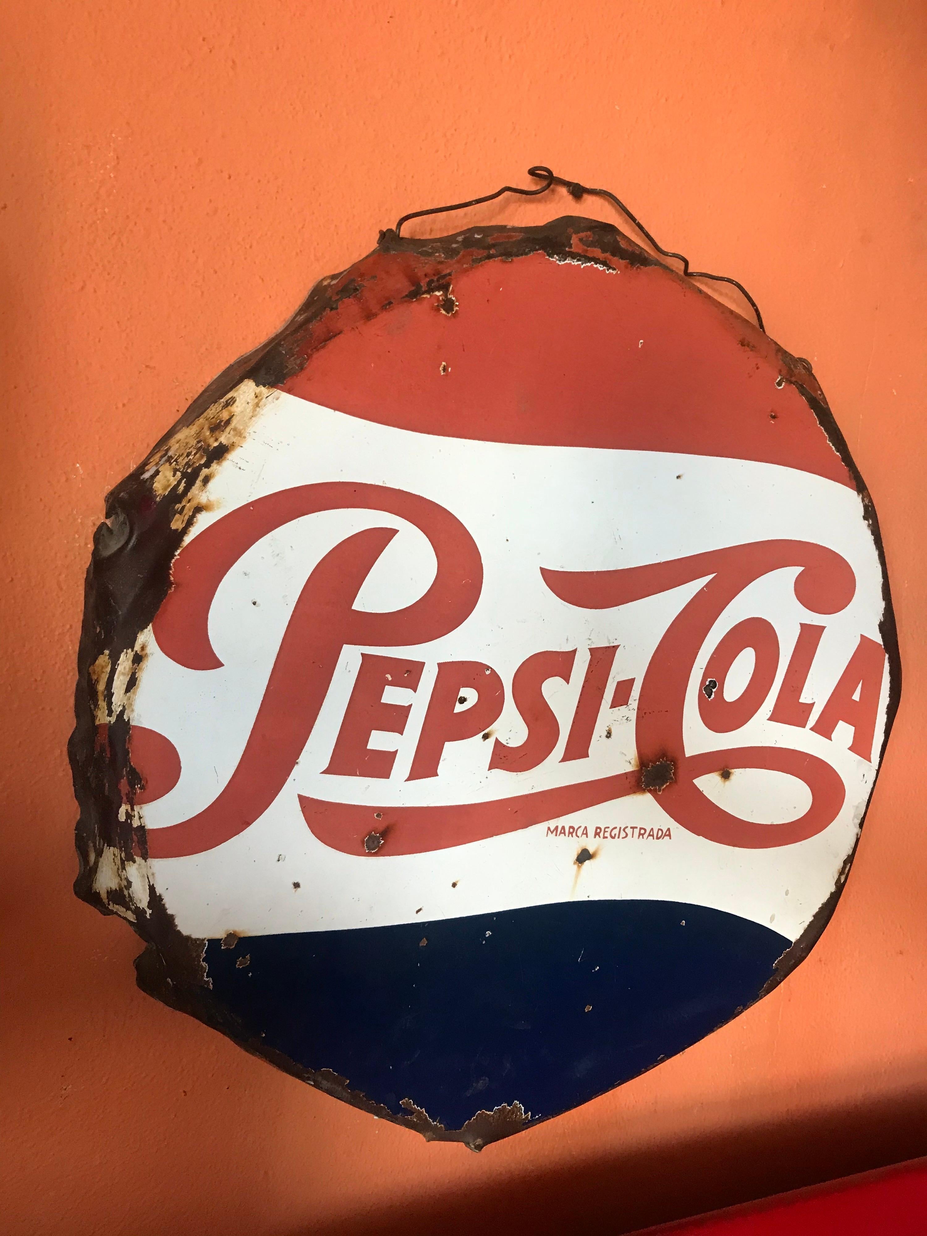 Distressed 1950’s Mexican Pepsi Cola metal and Porcelain sign.
22”inches diameter.