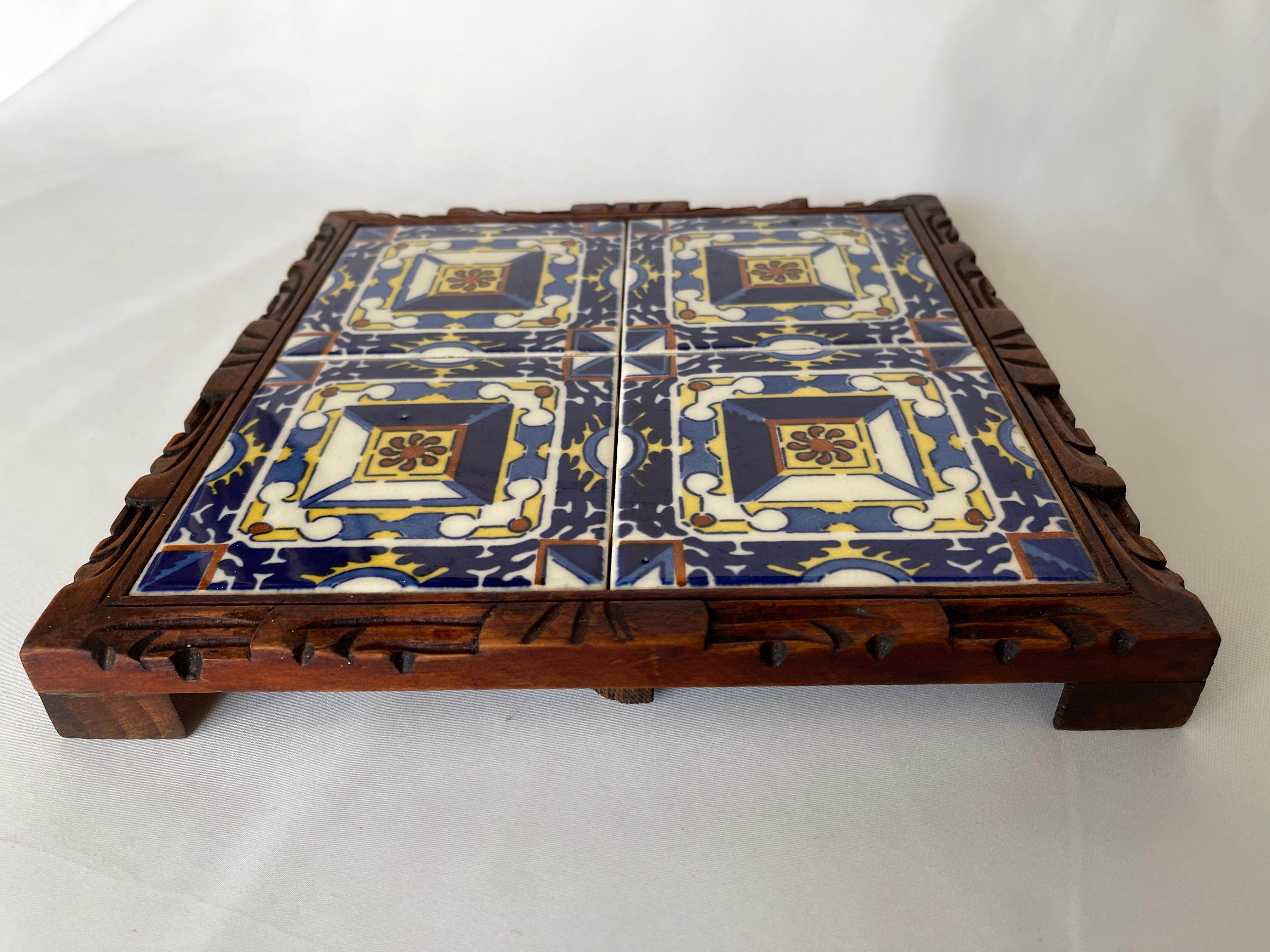 1950's Mexican tile square trivet tray with richly colored ceramic tile set in a hand carved wood framed footed base.