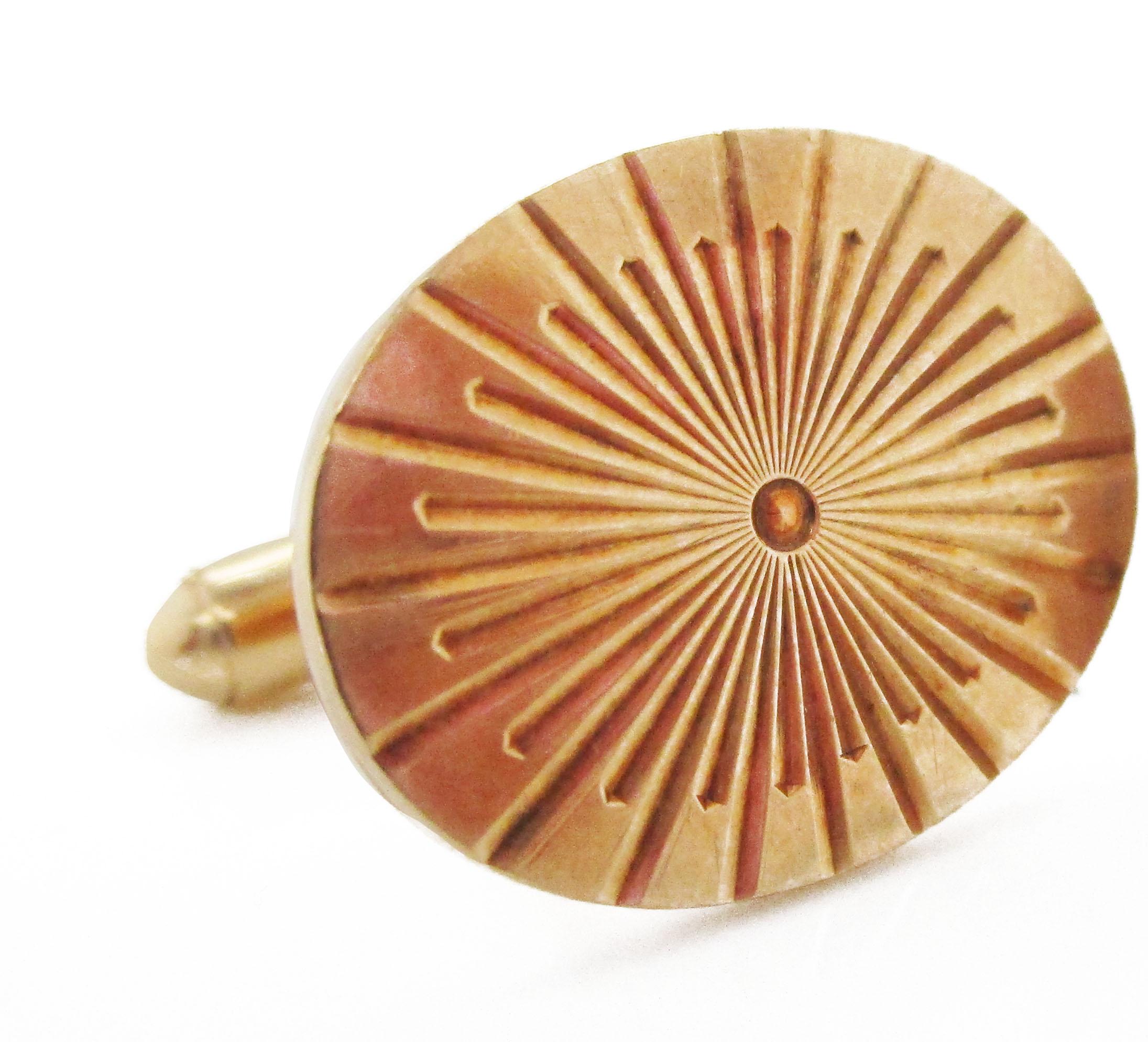 These dramatic mid-century cufflinks are from the 1950s and bear a fantastic sunburst pattern in 10k gold. The links are solid gold, giving them a stunning look that would stand apart from every other pair of cufflinks! The panels are a wonderful