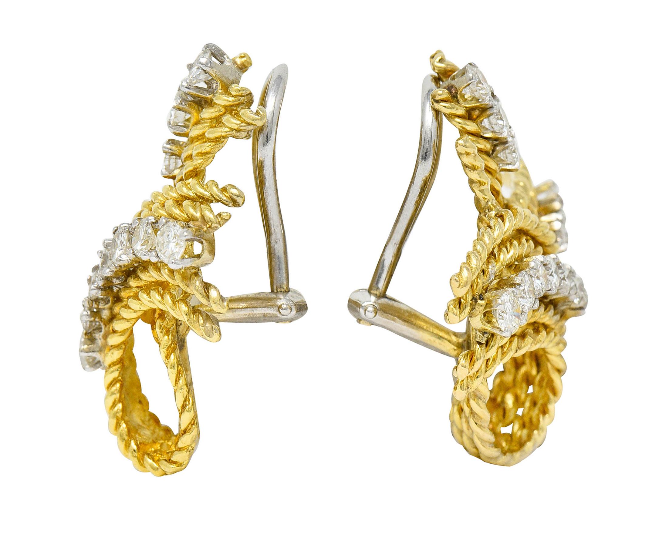 Ear-clip earrings are designed as looped strands of twisted rope - brightly polished

Accented by round brilliant cut diamonds that graduate in size - set in white gold

Weighing in total approximately 1.45 carats with G to J color and SI