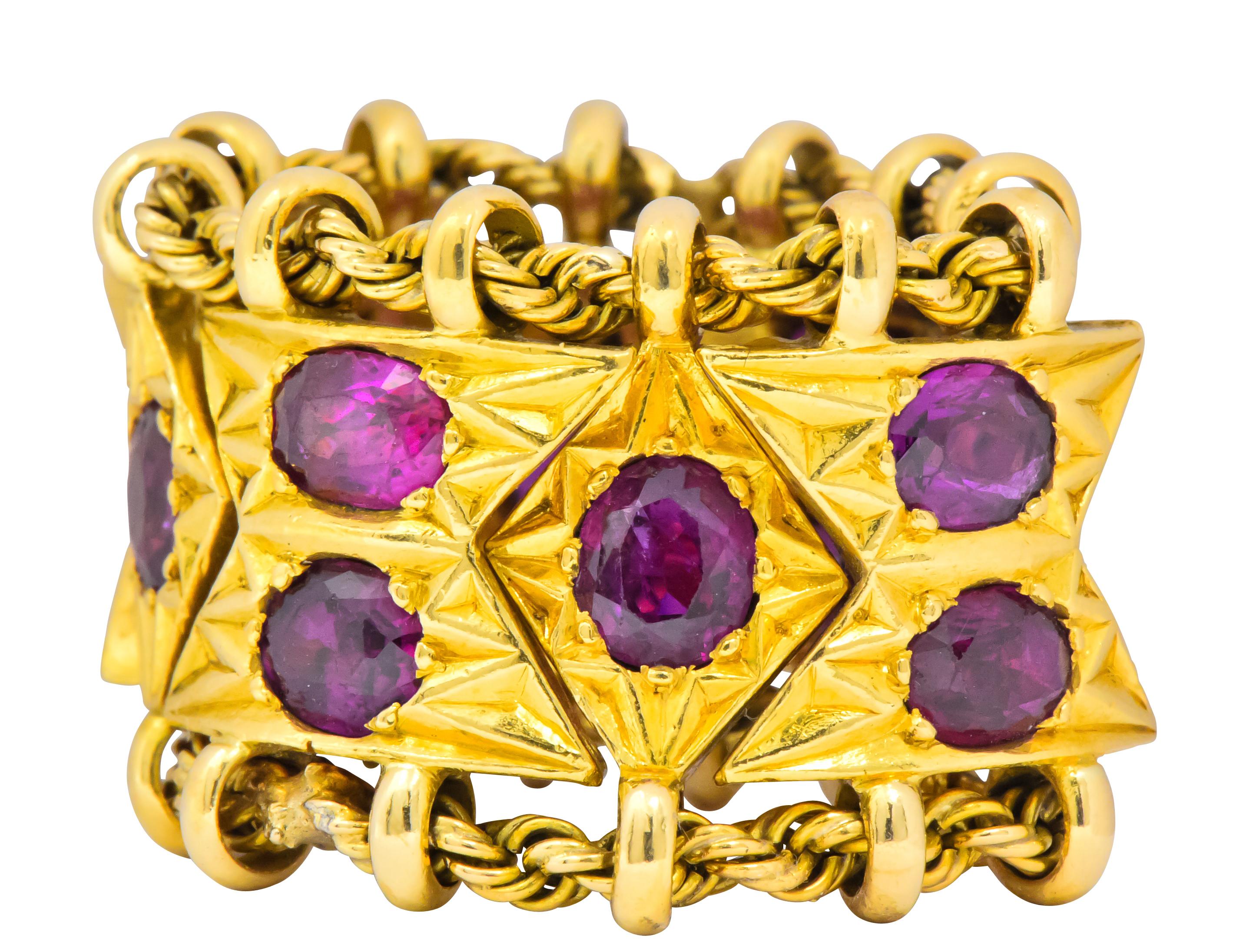 Really unique band style ring featuring dynamic chevron and navette shaped gold links each connected by a twisted gold rope chain; fully articulated

Bead set throughout by twelve well-matched oval cut rubies weighing in total 7.50 carats; very