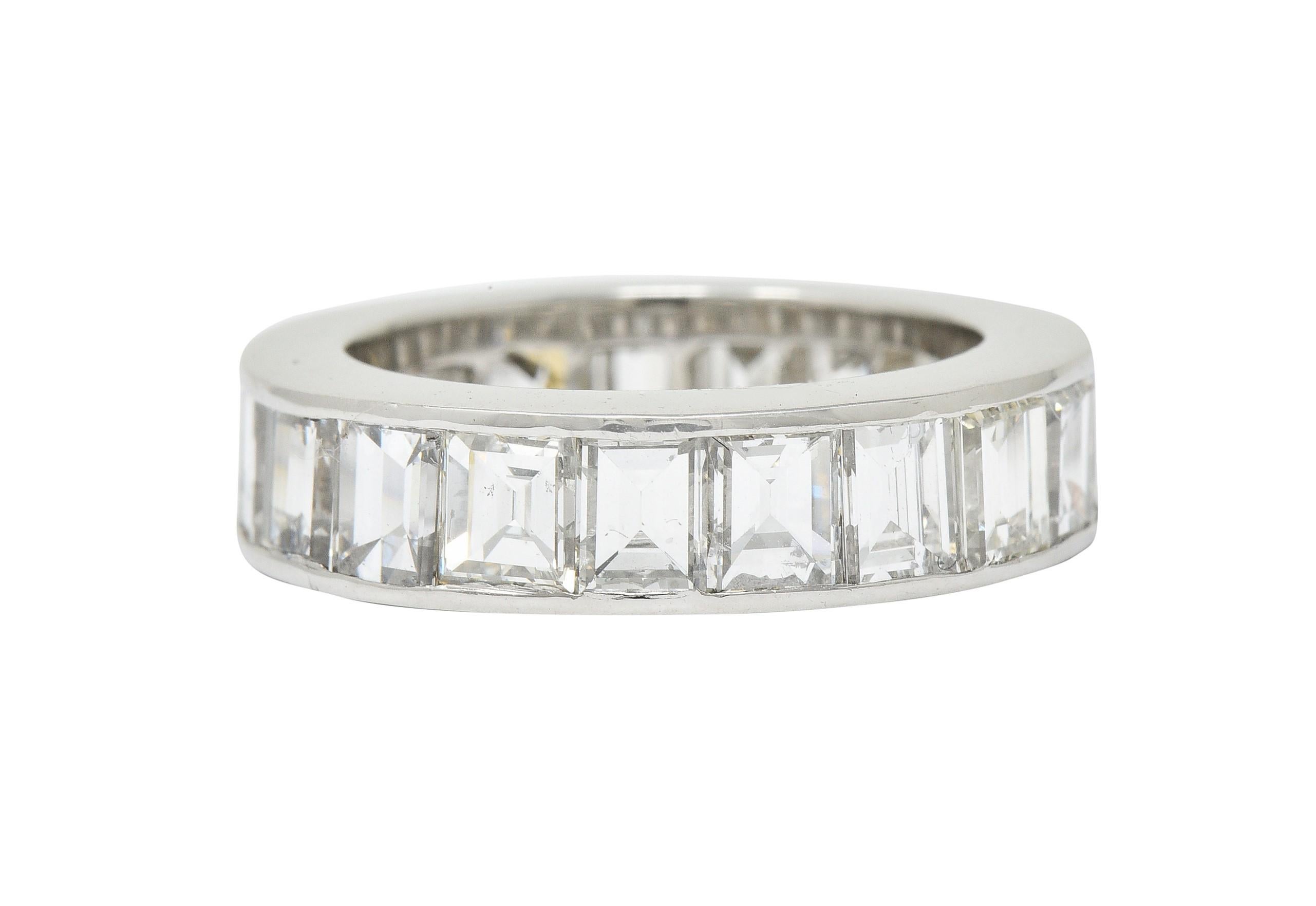 Eternity band ring channel set fully around with rectangular and square step cut diamonds

Weighing in total approximately 8.50 carats with H to J color and VS clarity

Completed by polished channel walls

Stamped PLAT for platinum

Circa: