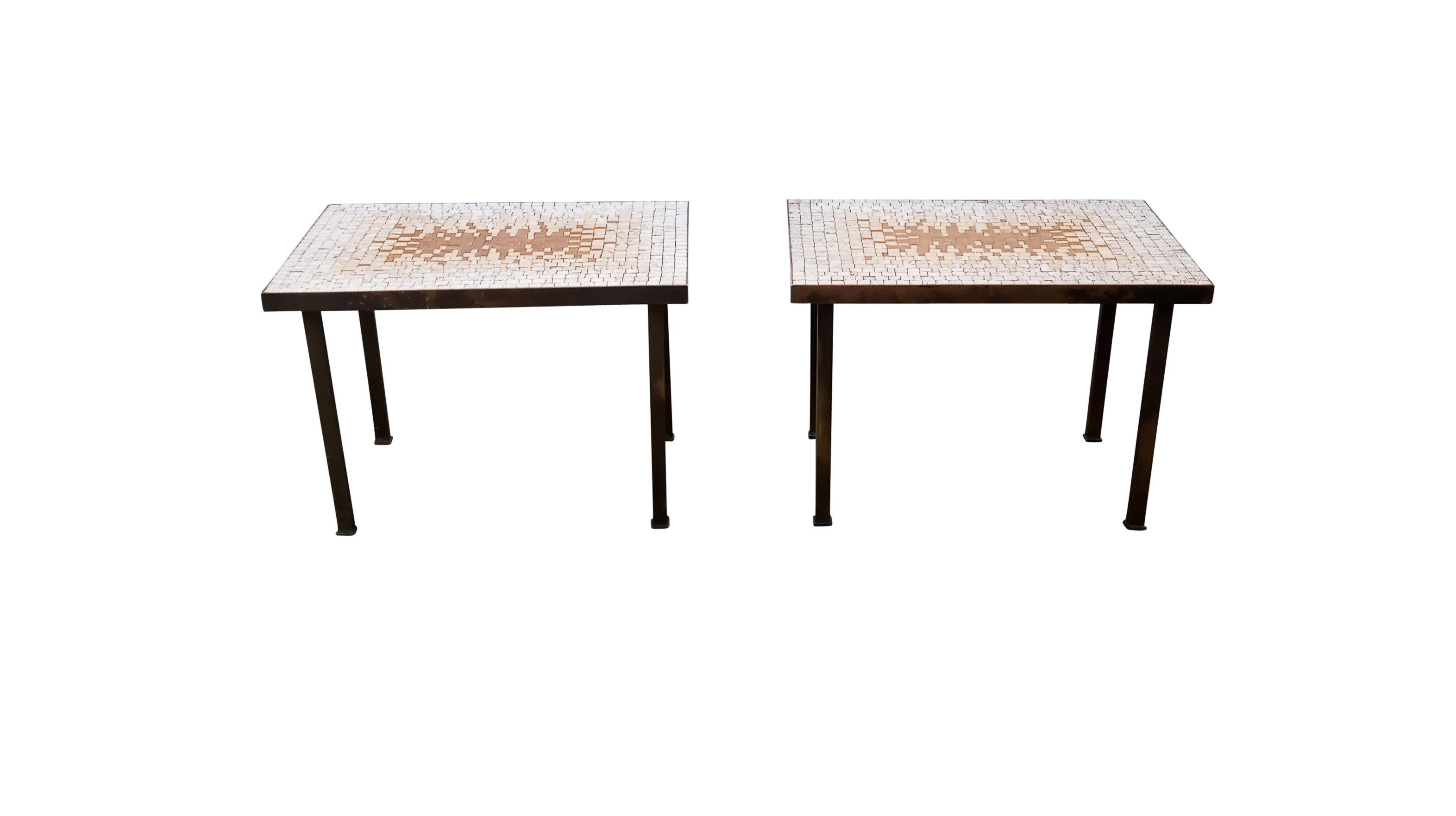 In the style of Gordon & Marshall Martz, Edward Wormley, or Samson Berman, this pair of truly vintage side tables is sure to be a crowd-pleaser. The tops have an elaborate and beautiful sunburst pattern of handplaced ceramic tiles trimmed in aged