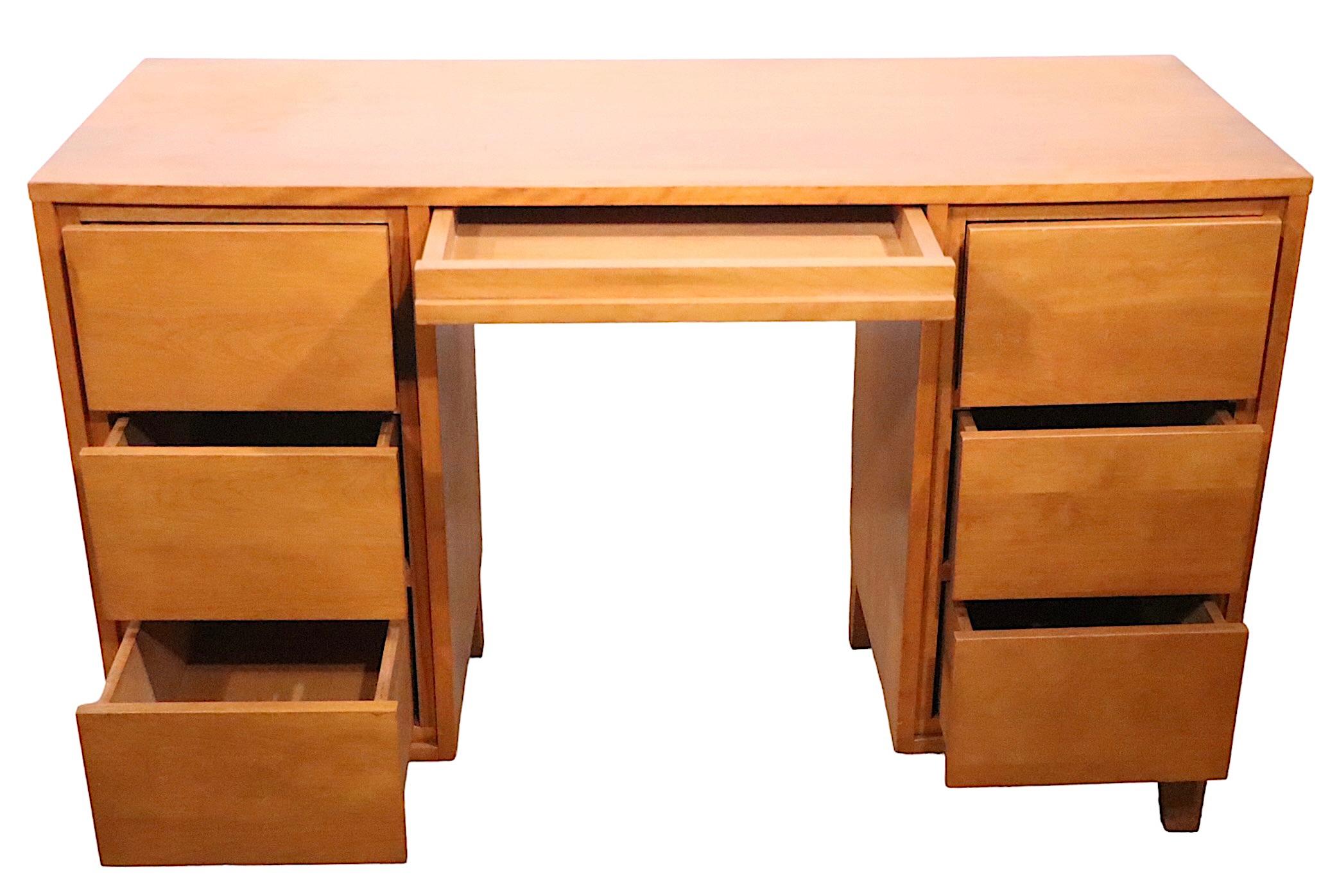 Architectural Mid Century desk, with original chair, designed by Leslie Diamond, for Conant Ball, as part of their hugely successful Modern Mates series.  This piece is constructed of solid wood, the drawers are all fully functional and work