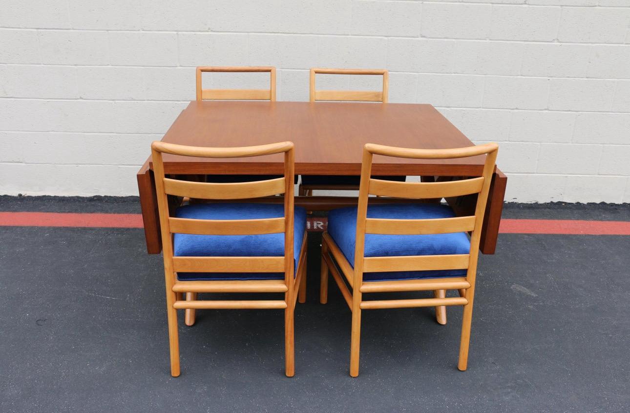 Spectacular dining set designed by t.h. Robsjohn-Gibbings for Widdicomb, it has the label in the bottom of the table. This table has two dropper leaf. The top is made of walnut, and the base is made of maple. Very solid and sturdy table. It comes