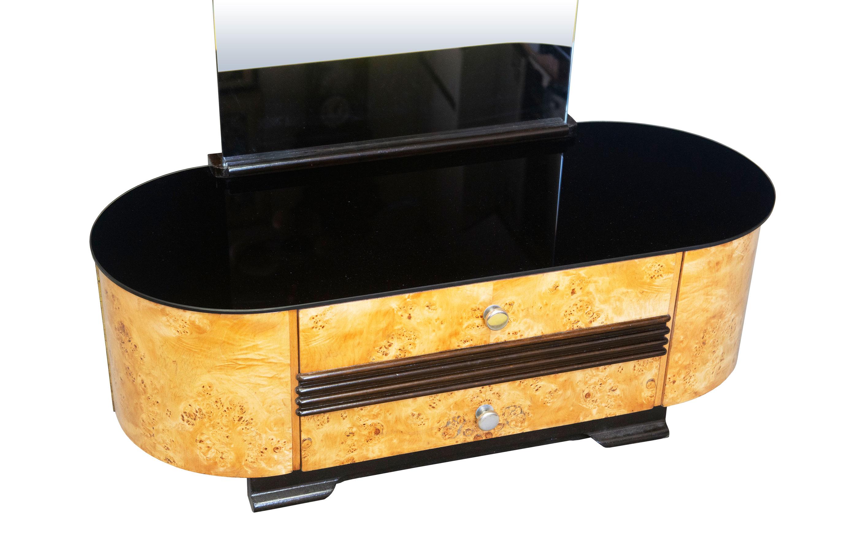 This mid century dressing table was produced by the renown UP Brno Furniture factory in the late 1940’s where Jindrich Halabala was the Art Director at the time.

This dressing table is a rare piece and we believe that it was part of furniture