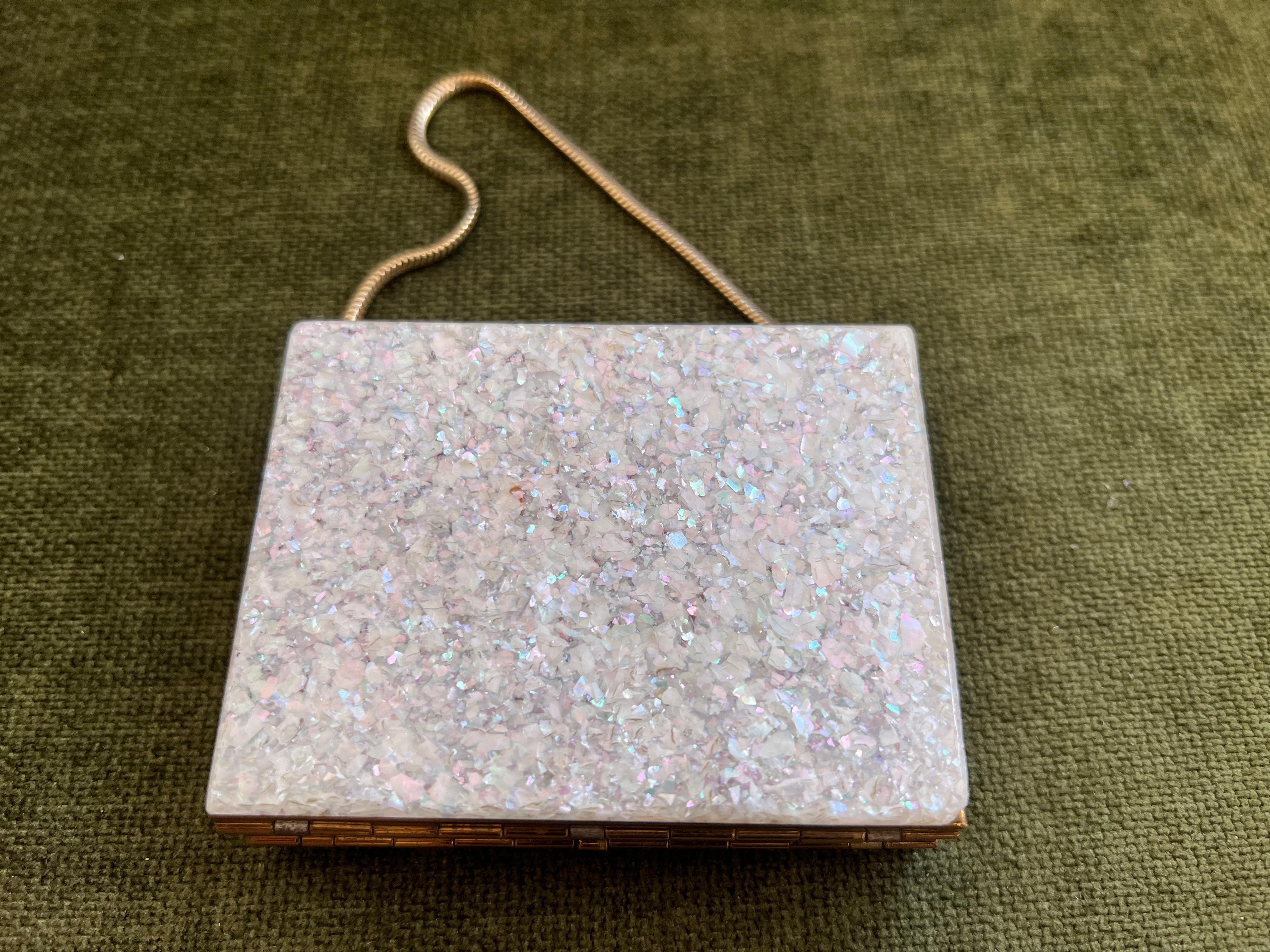 1950s mid-century EVANS wristlet compact and cigarette case with Mother of Pearl cover.
This elegant vintage wristlet is in excellent condition and perfectly giftable in quality and presentation. This piece has been tucked away for decades and shows